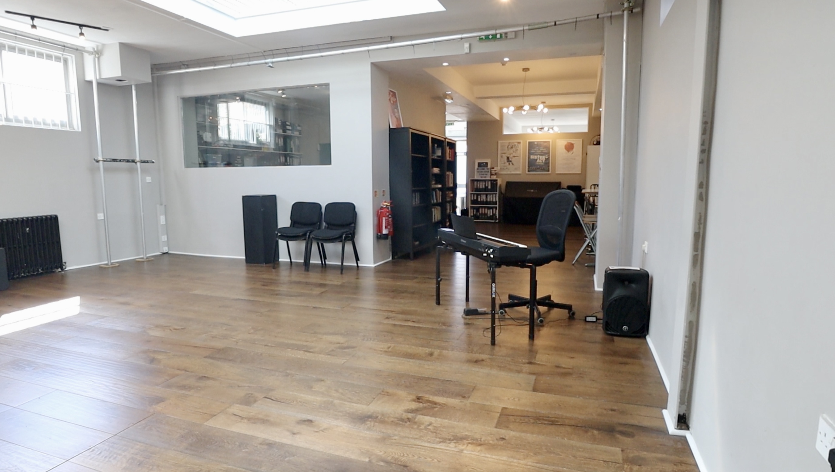 Ground floor studio with hardwood flooring, ideal for workshops and meetings.