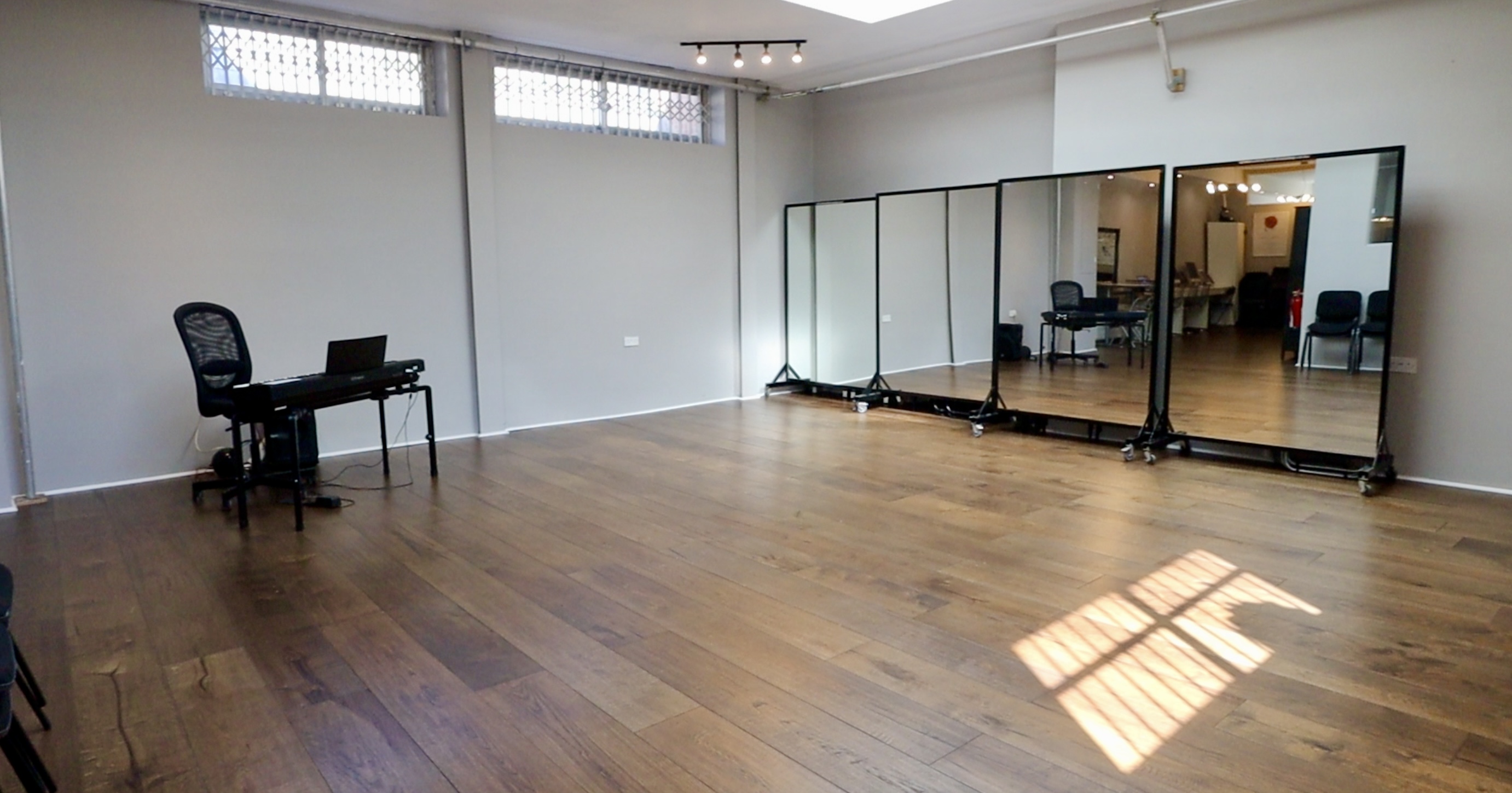 Ground floor studio with polished wooden floors for meetings and workshops.