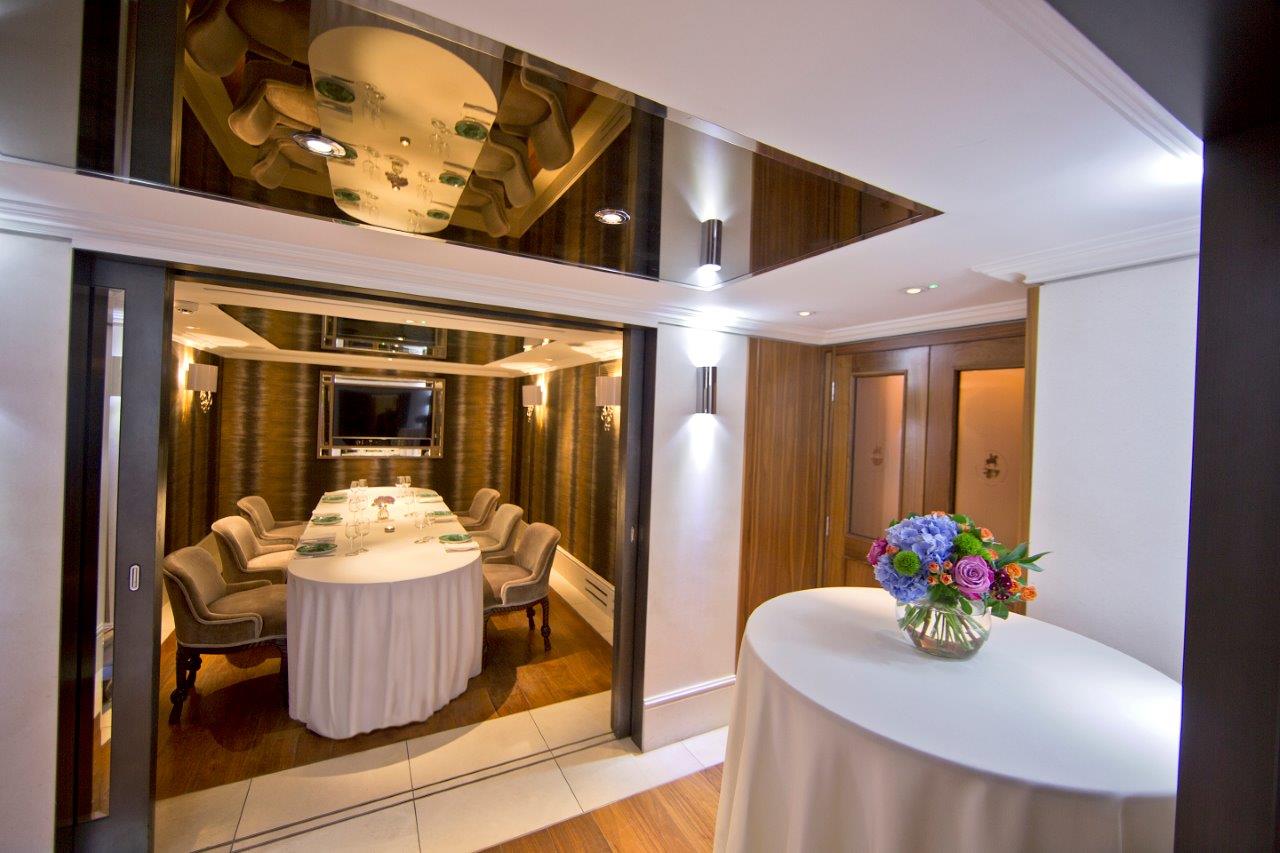 Wellington Boardroom at St. James's Hotel: elegant round table for meetings and events.