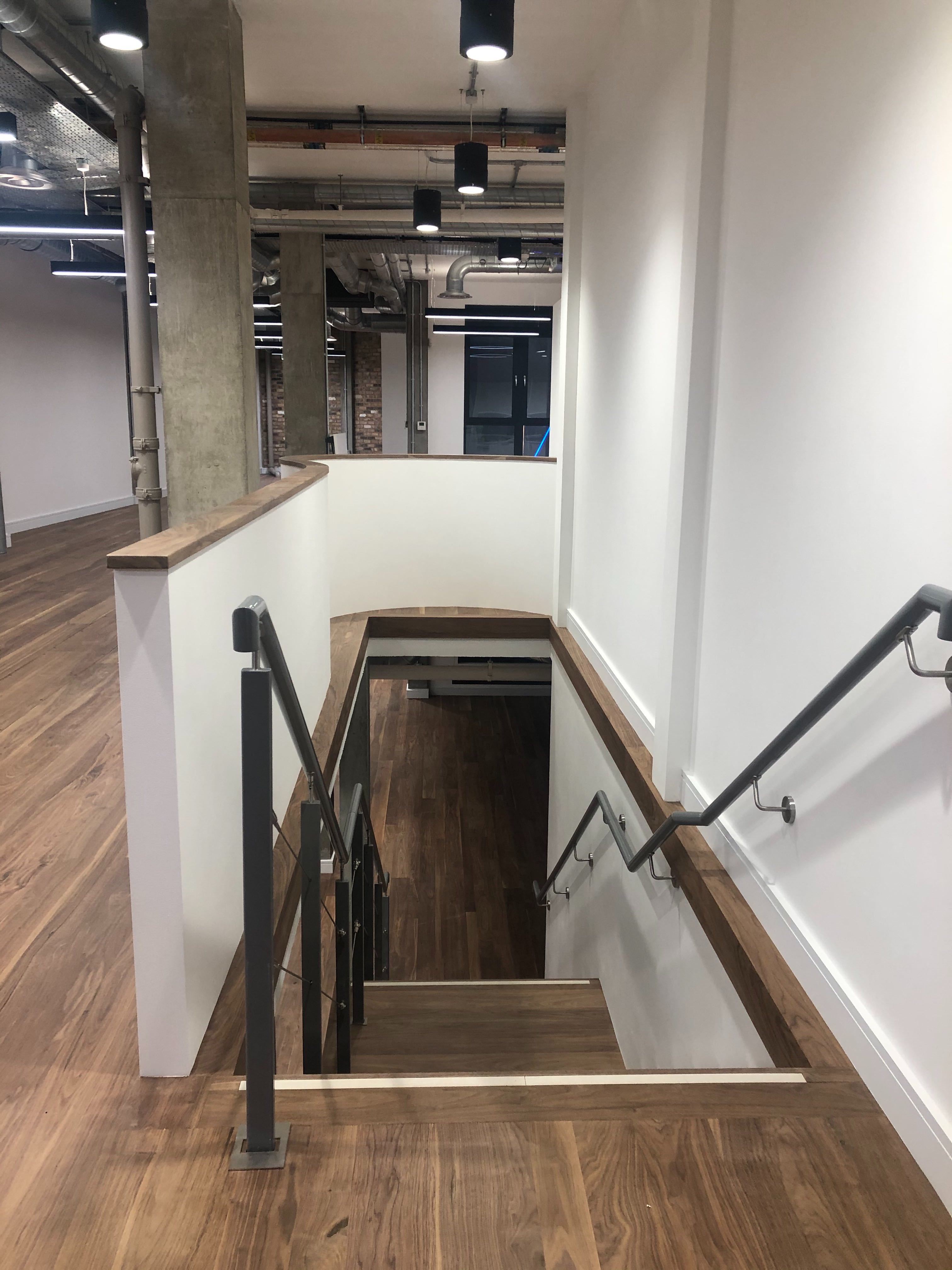 Modern staircase in Prescot Street venue, ideal for breakout sessions and gatherings.