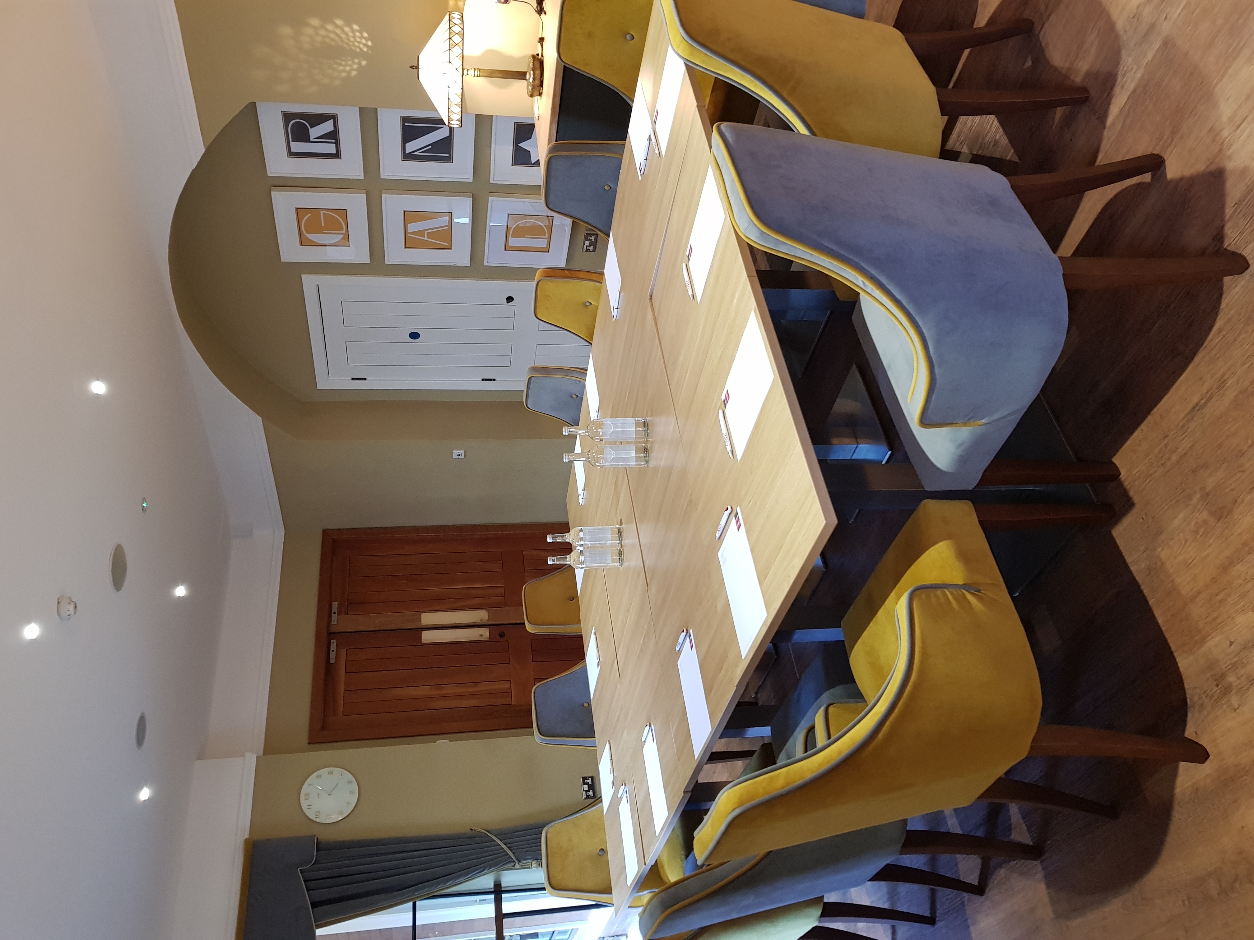 Spotlight Lounge meeting room with stylish chairs, perfect for workshops and presentations.