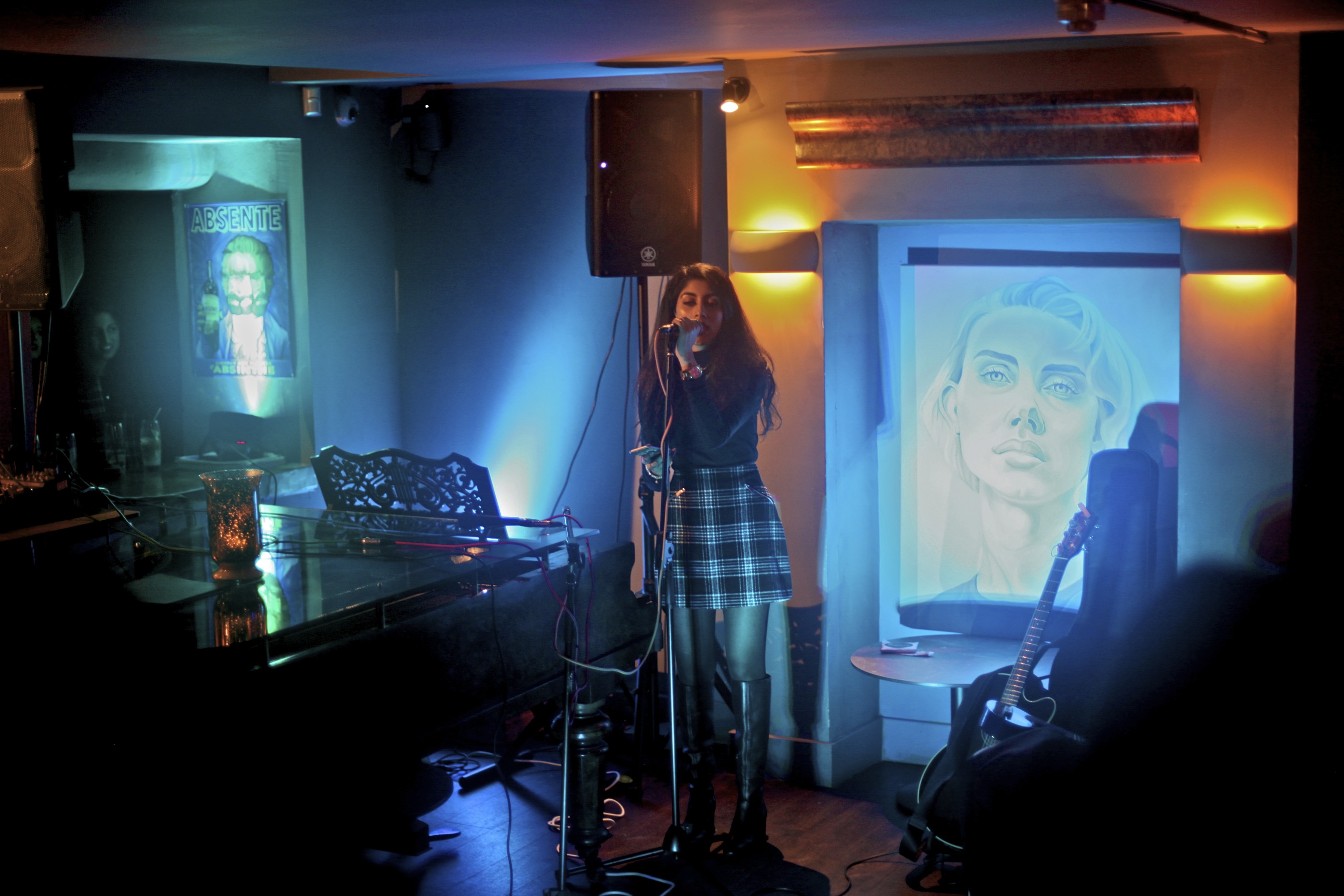 Intimate live music venue with cozy lighting at Sandy's Piano Bar.