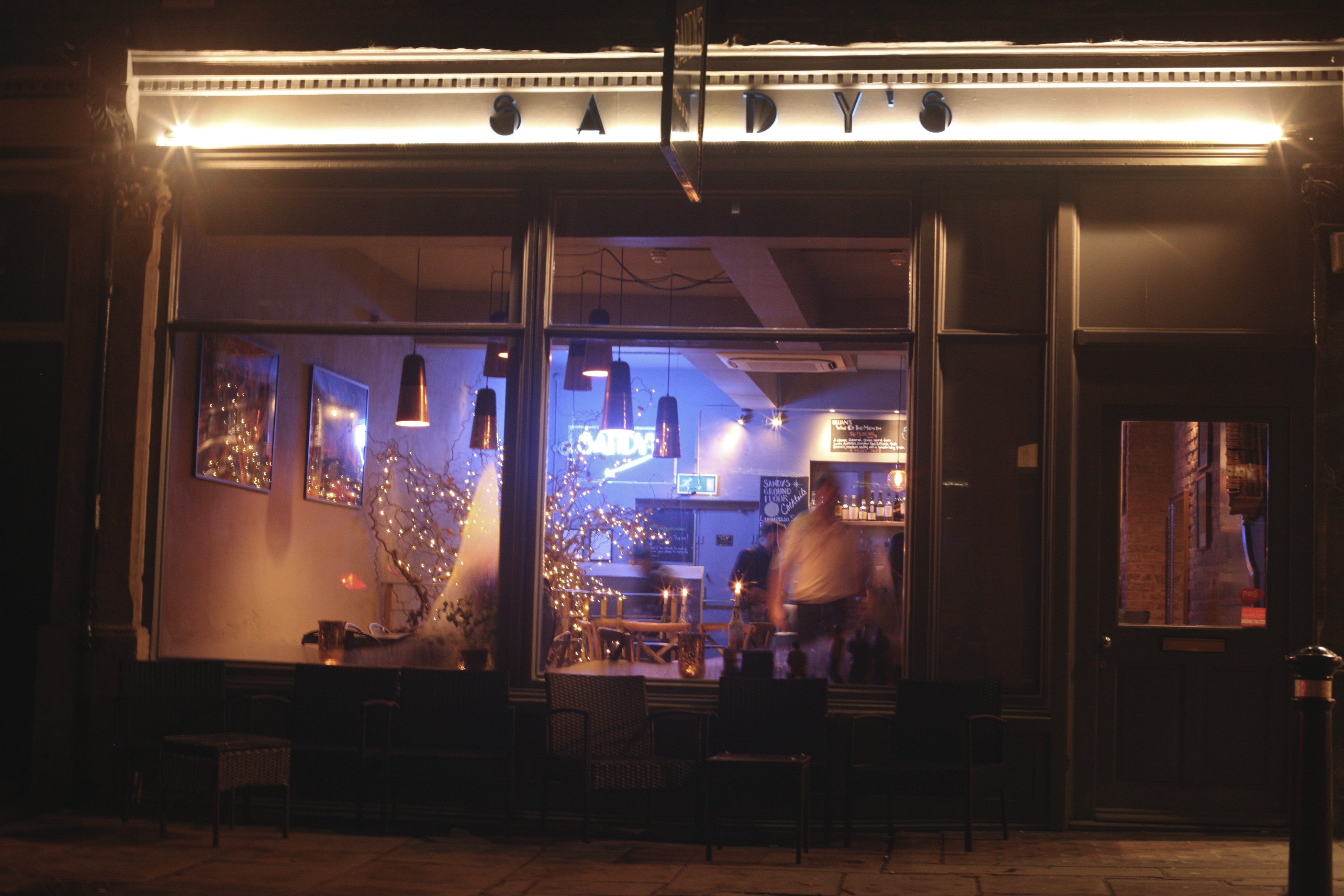 Vibrant basement venue with warm lighting for intimate gatherings and networking events.