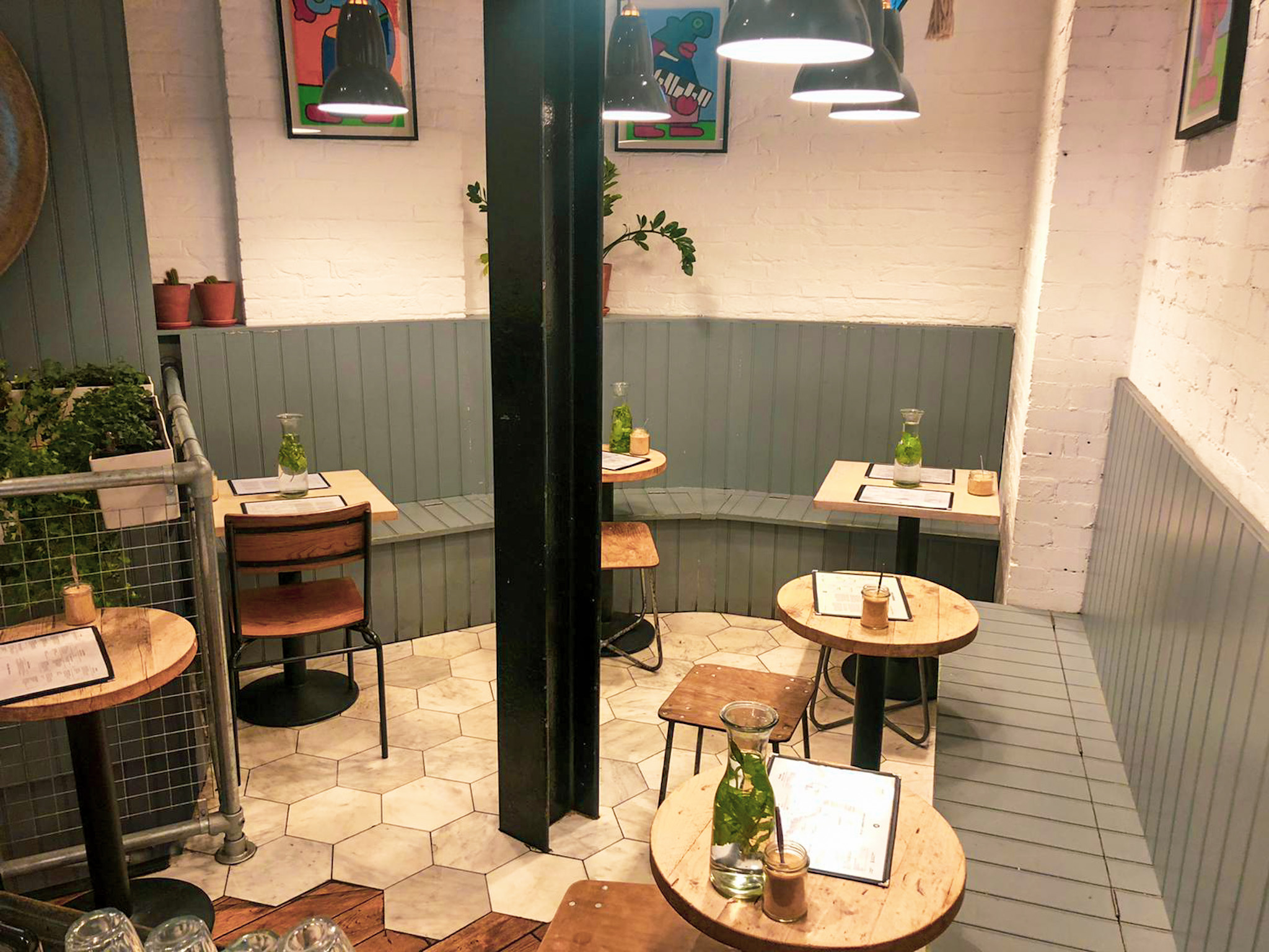 Cozy dining space with wooden tables for intimate meetings and private events in Clerkenwell.