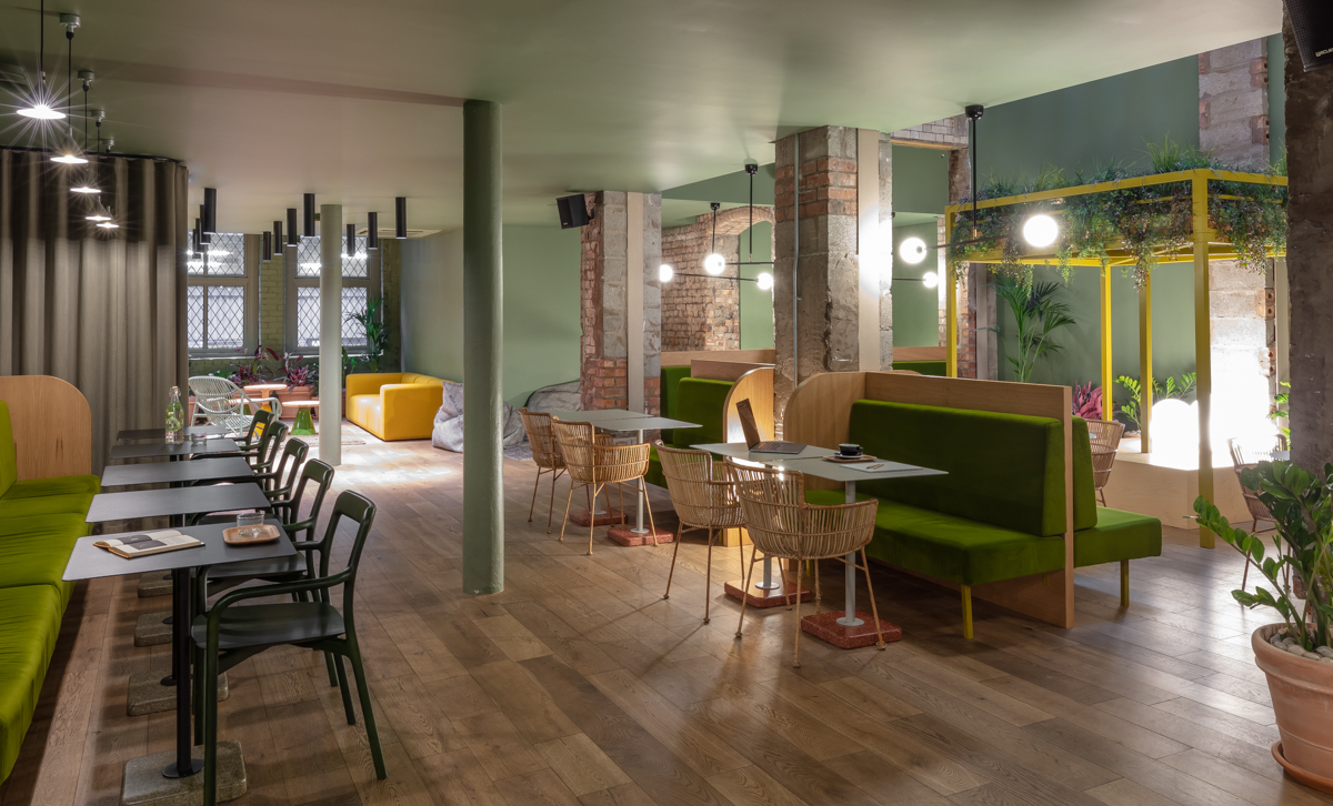 Coworking space at Whitworth Locke with greenery, ideal for workshops and networking.