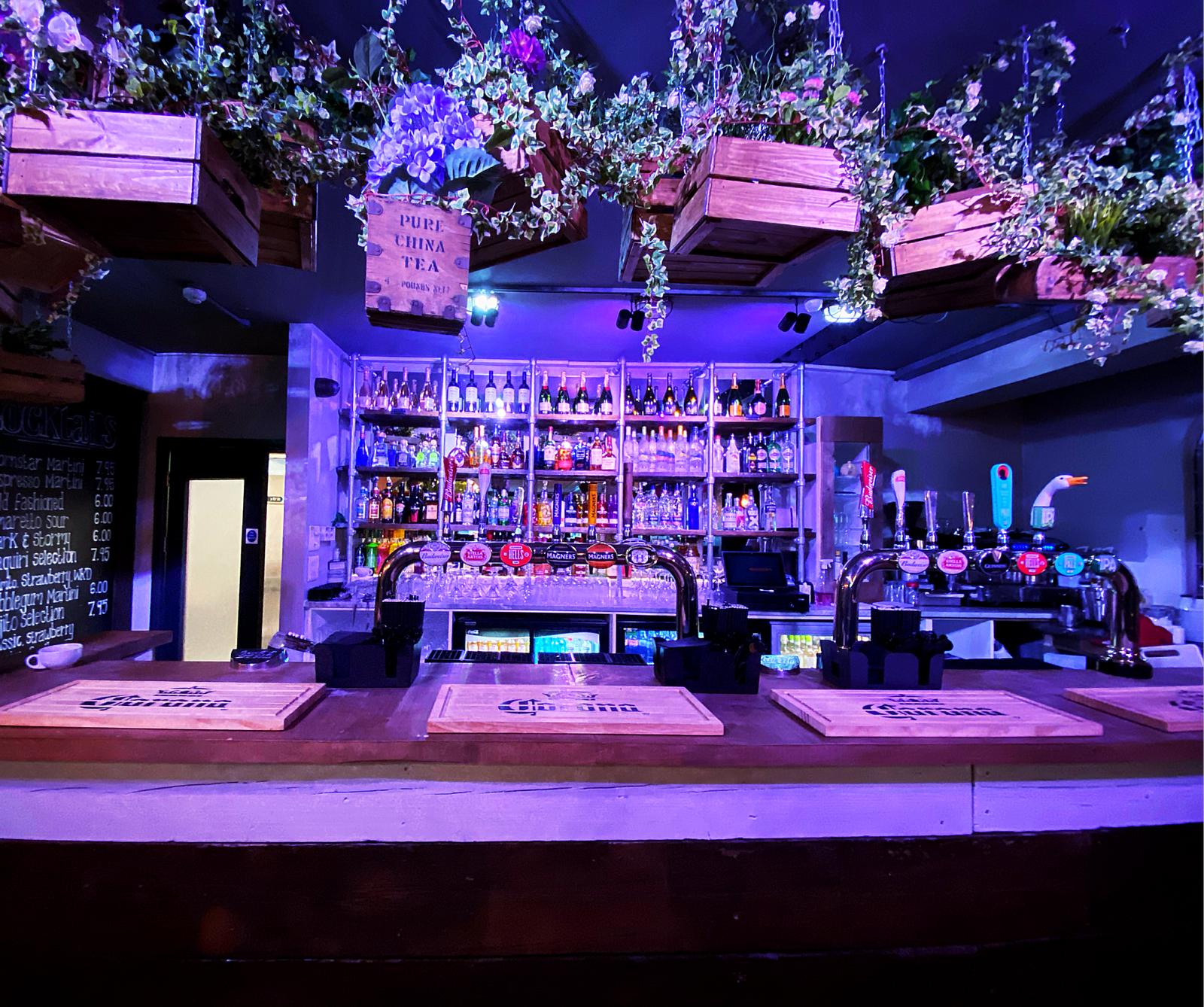 Vibrant bar setup at Maddison's for events, featuring craft beers and inviting ambiance.