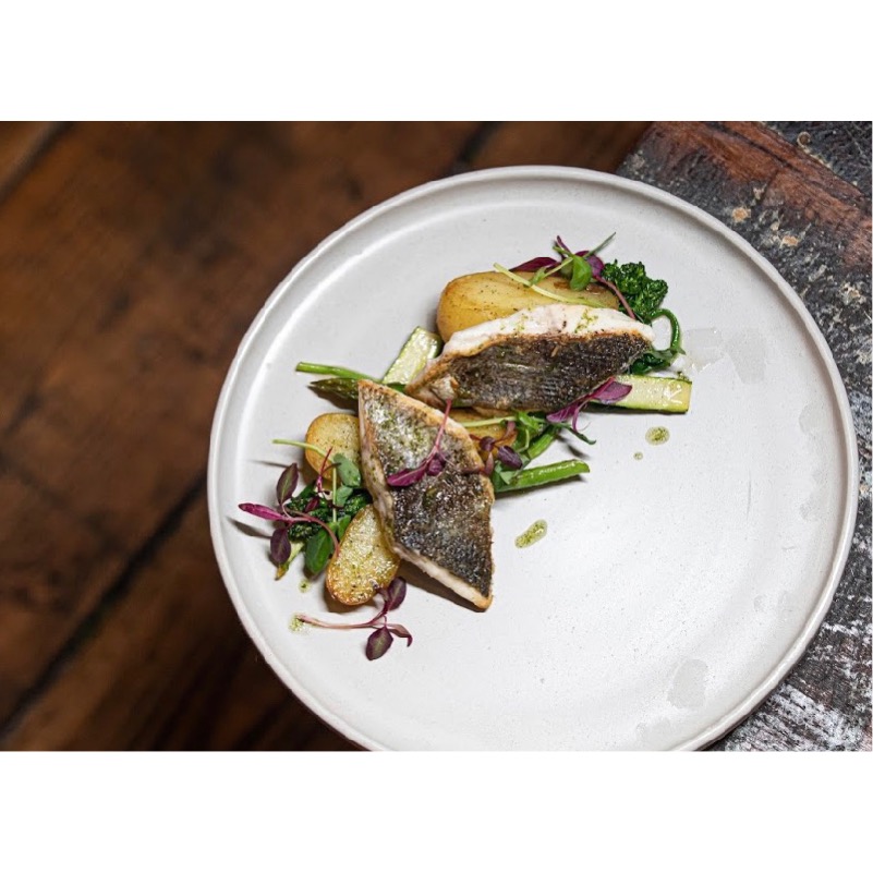 Seared fish dish at Maddison's Bar & Kitchen, showcasing quality catering for events.