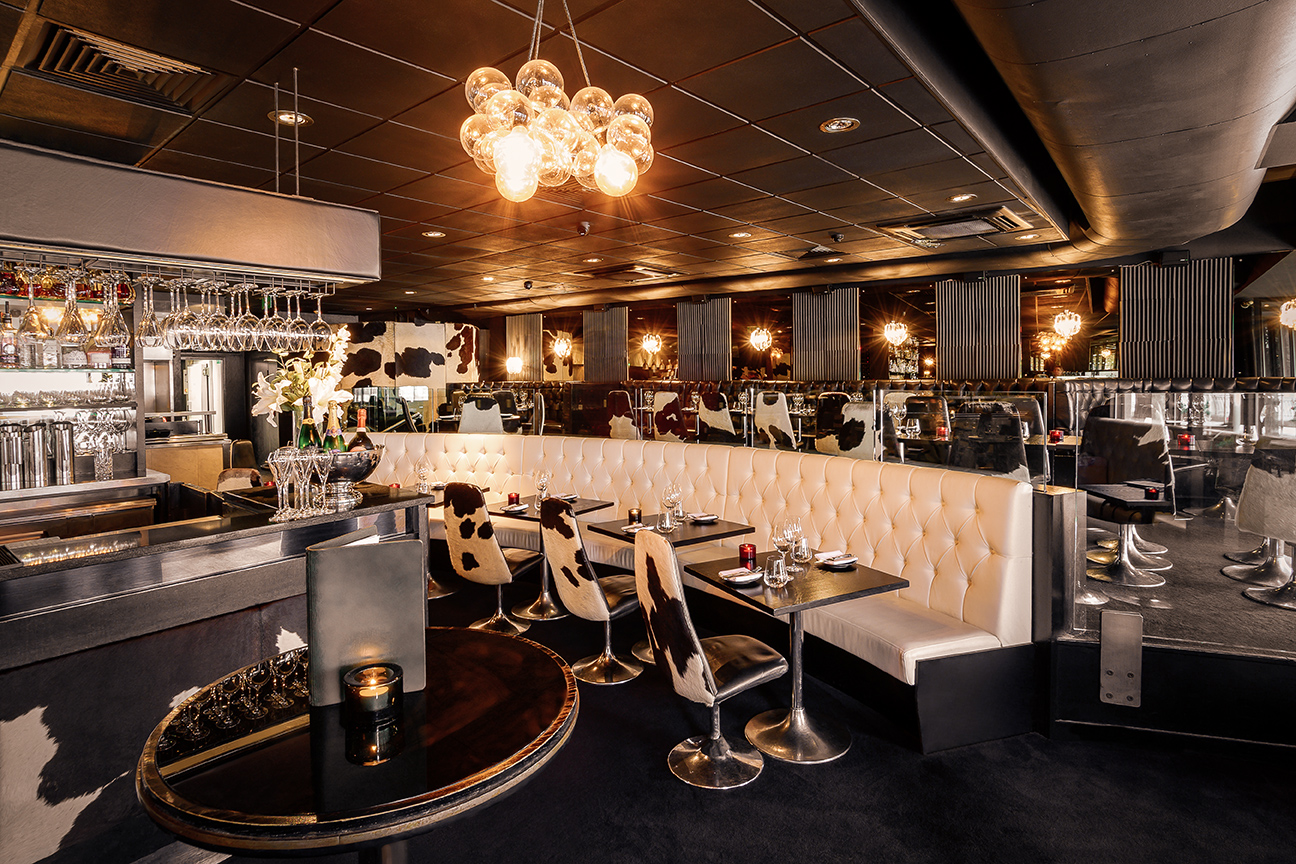 Stylish restaurant interior at Gaucho Canary Wharf, perfect for corporate dinners and events.