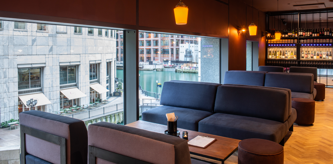 Stylish lounge at The Mezzanine, Vagabond Canary Wharf, perfect for networking events.