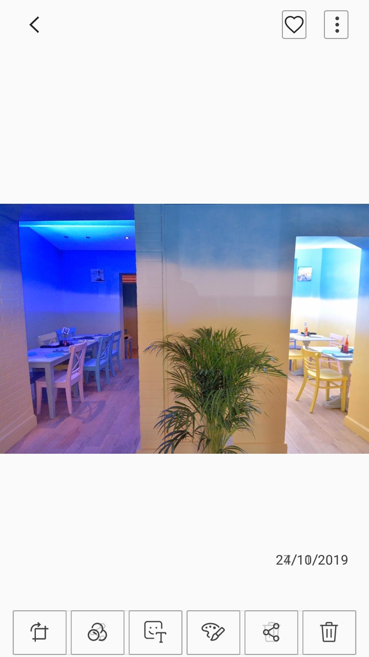 Vibrant venue with blue walls for intimate gatherings and networking events.