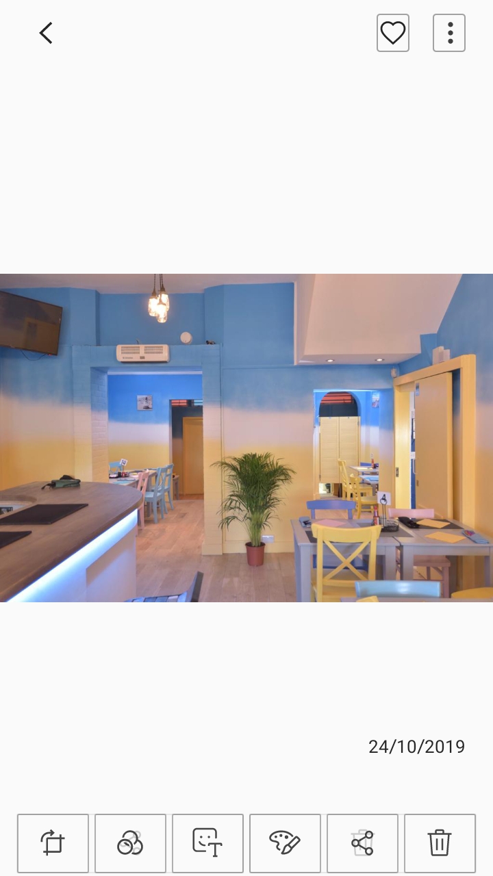 Vibrant beach-inspired event space with colorful chairs for casual gatherings.