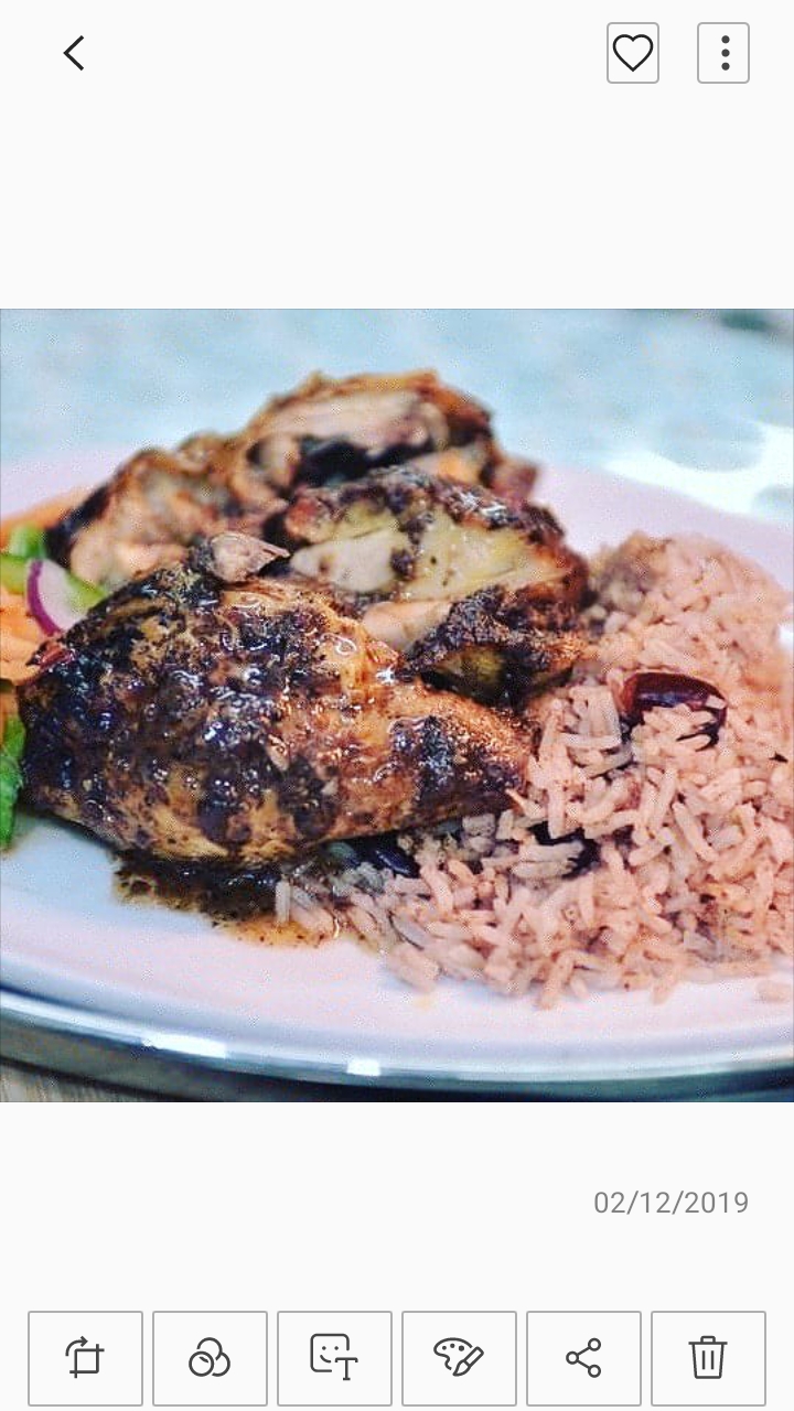Grilled chicken dish with rice and vegetables at an event venue for networking.