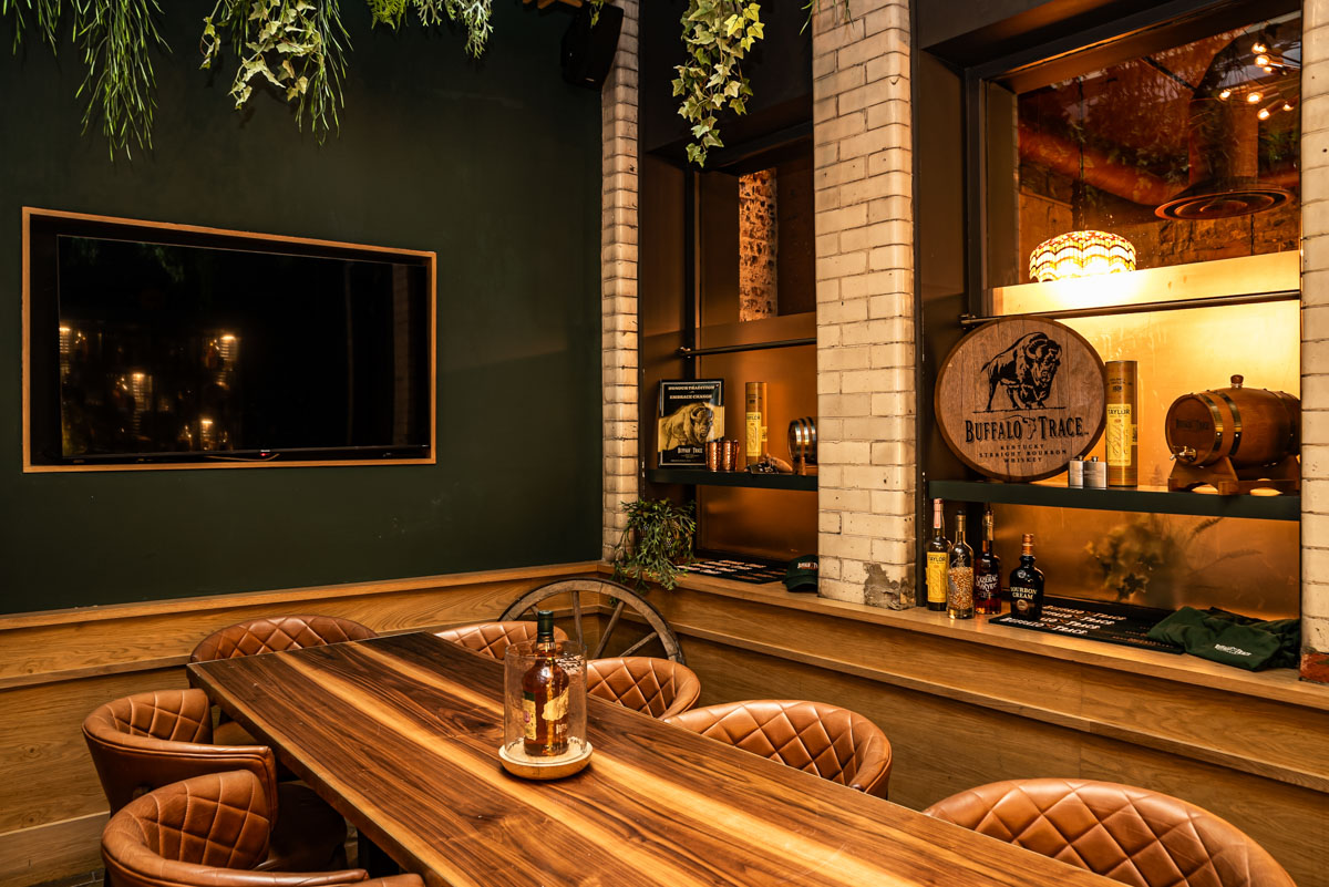 Private dining room at The Wren Tavern, featuring plush seating for meetings and events.