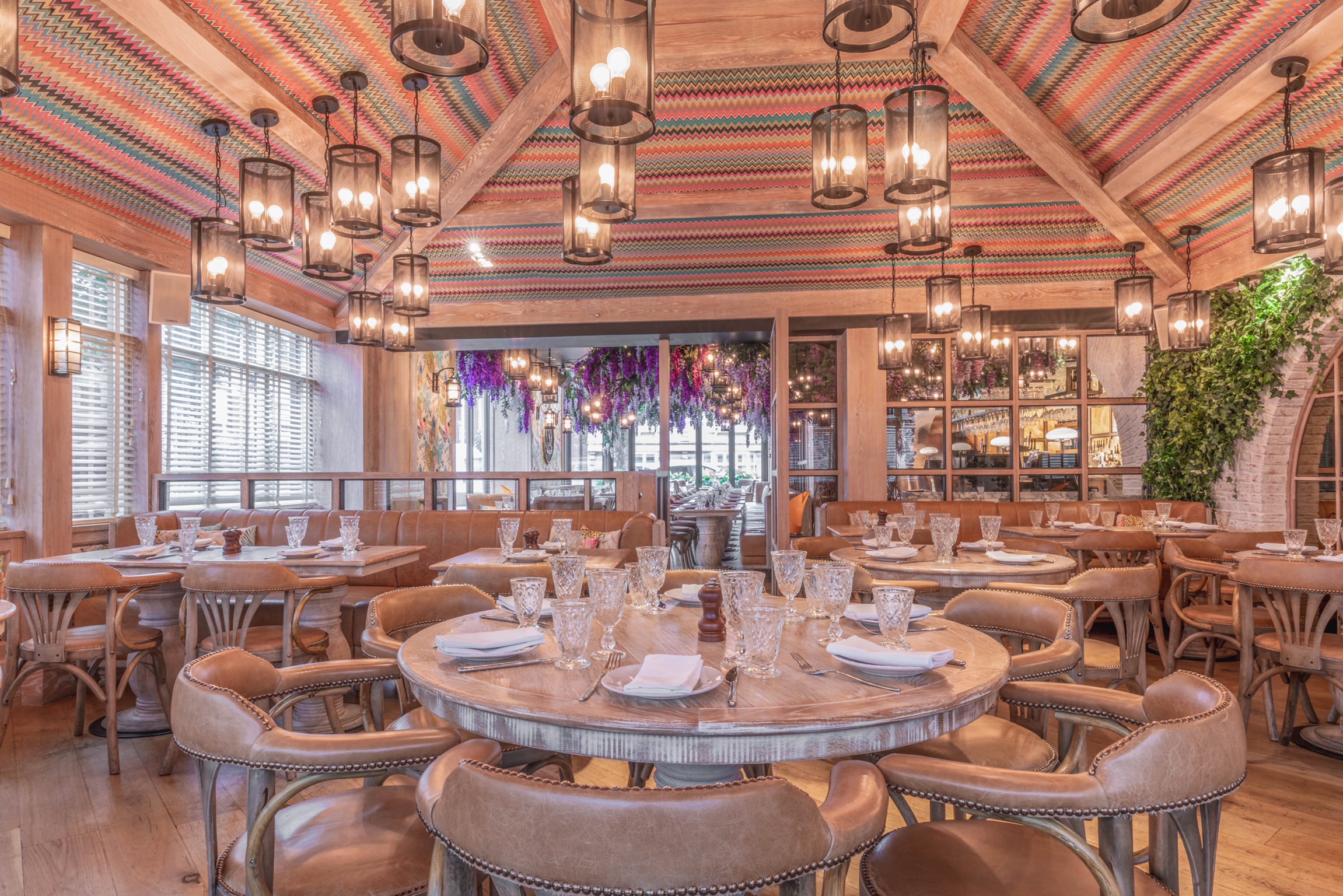 Orangery dining space with warm lighting for intimate gatherings and corporate events.