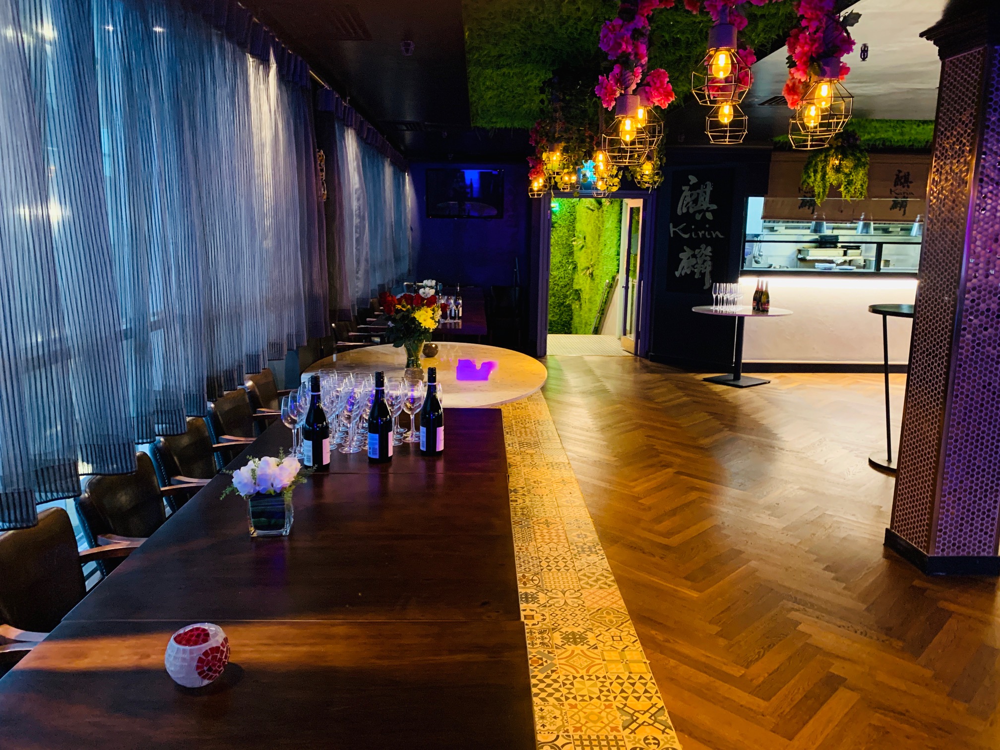 Stylish event space with wooden table for intimate gatherings at Kirin Japanese Restaurant.