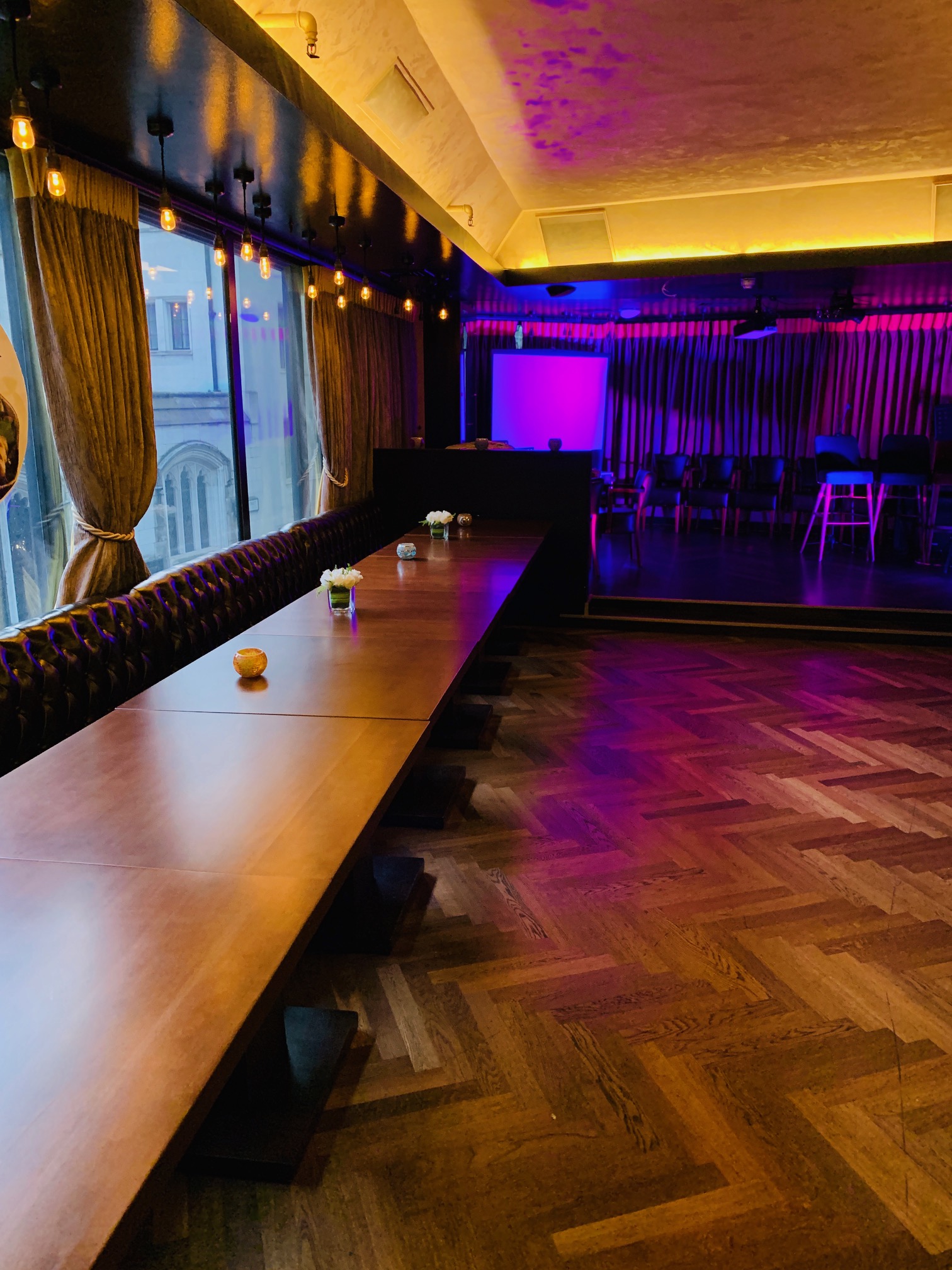 Elegant event space at Kirin Japanese Restaurant with natural light and purple ambiance.