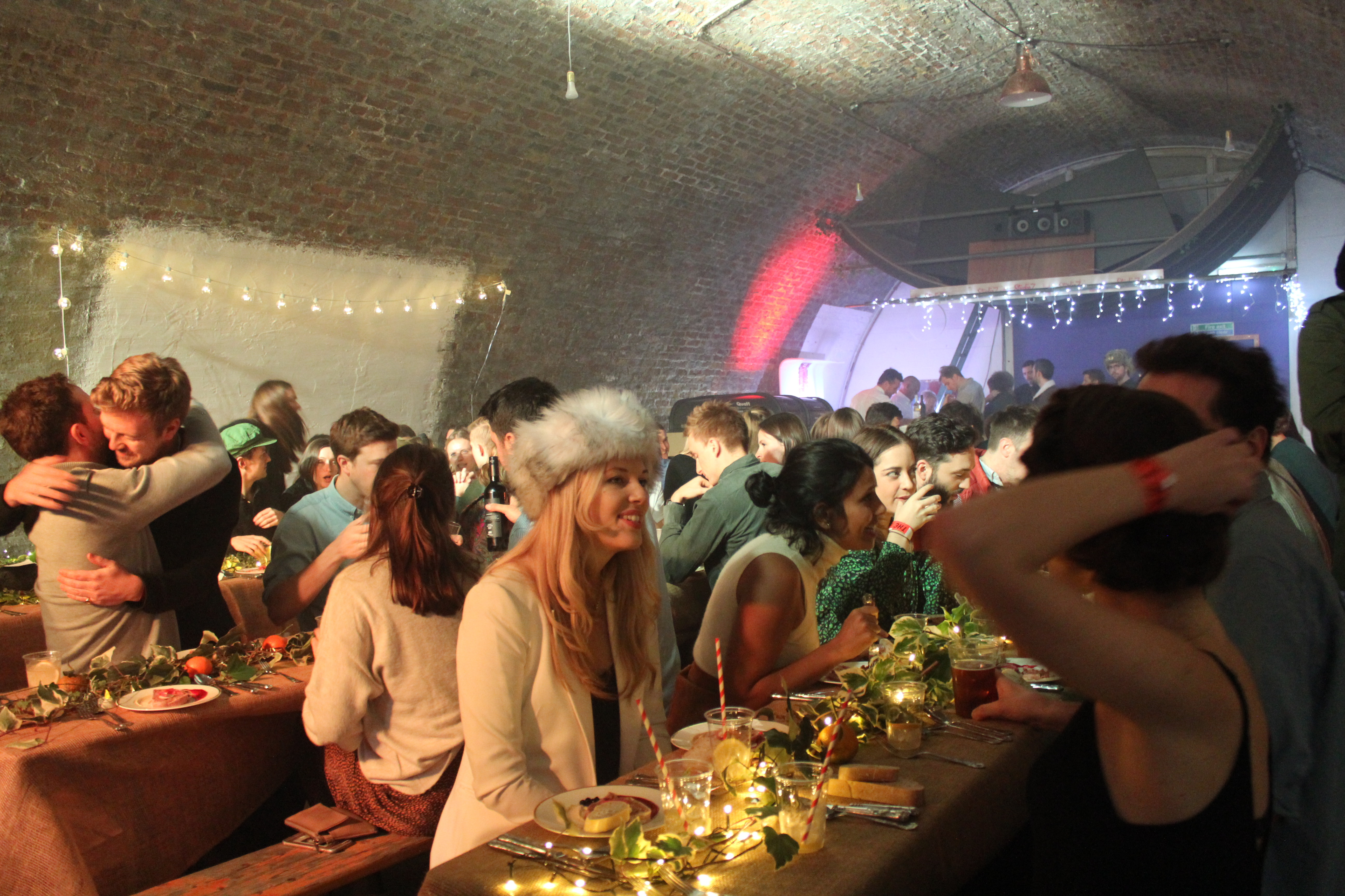 Vibrant event at Studio Z Brixton with intimate lighting and lush greenery.