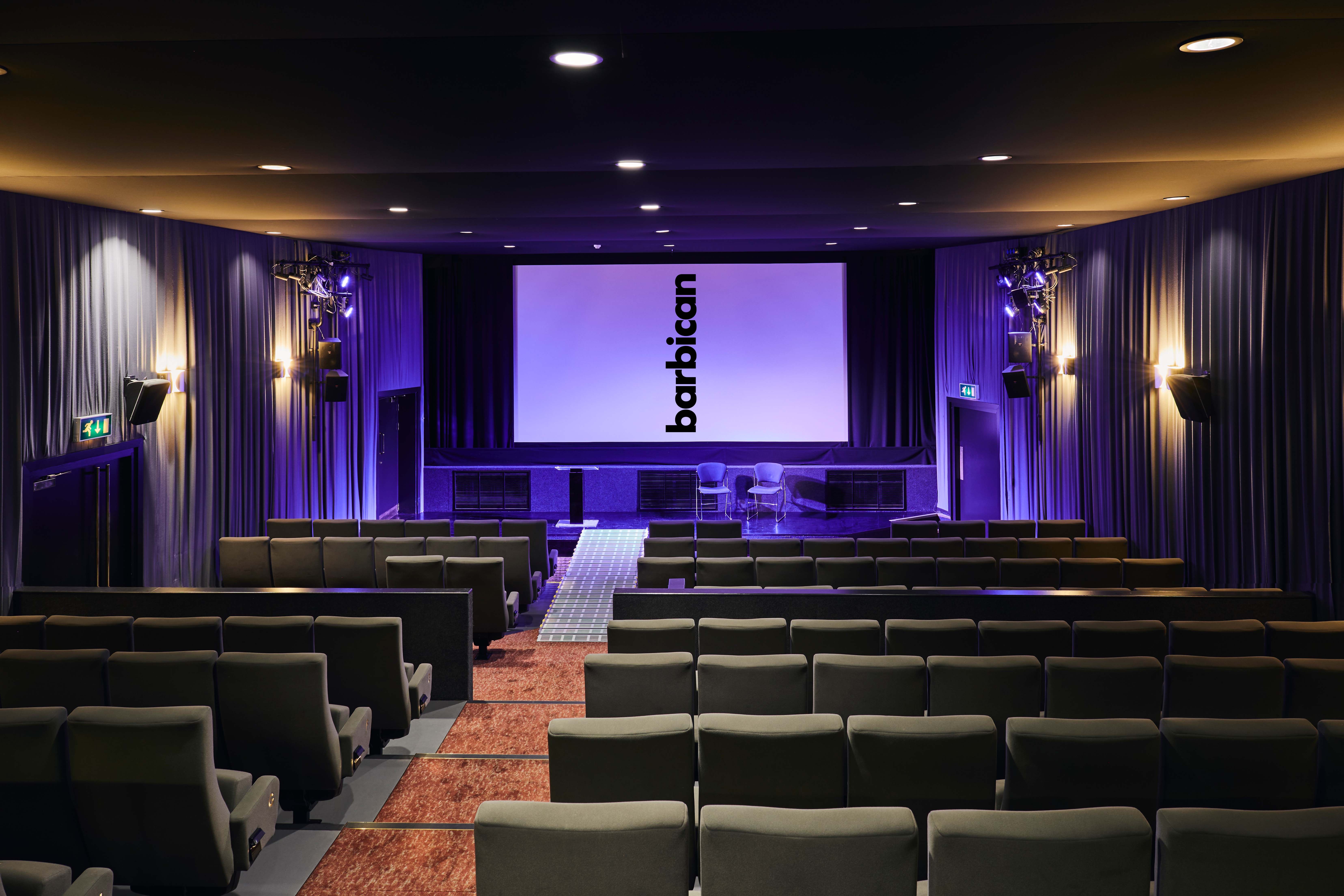 Modern theater at Barbican Centre with large screen for corporate events and screenings.