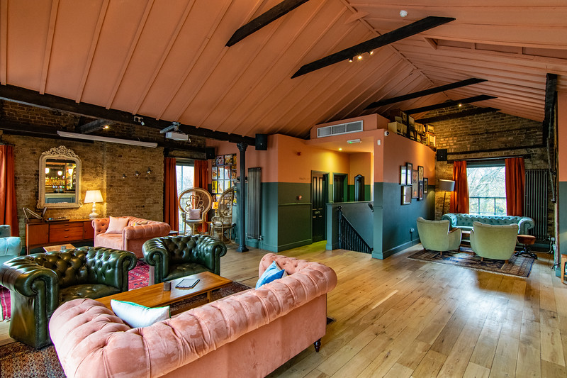 Stylish event space with warm decor, ideal for networking and gatherings.