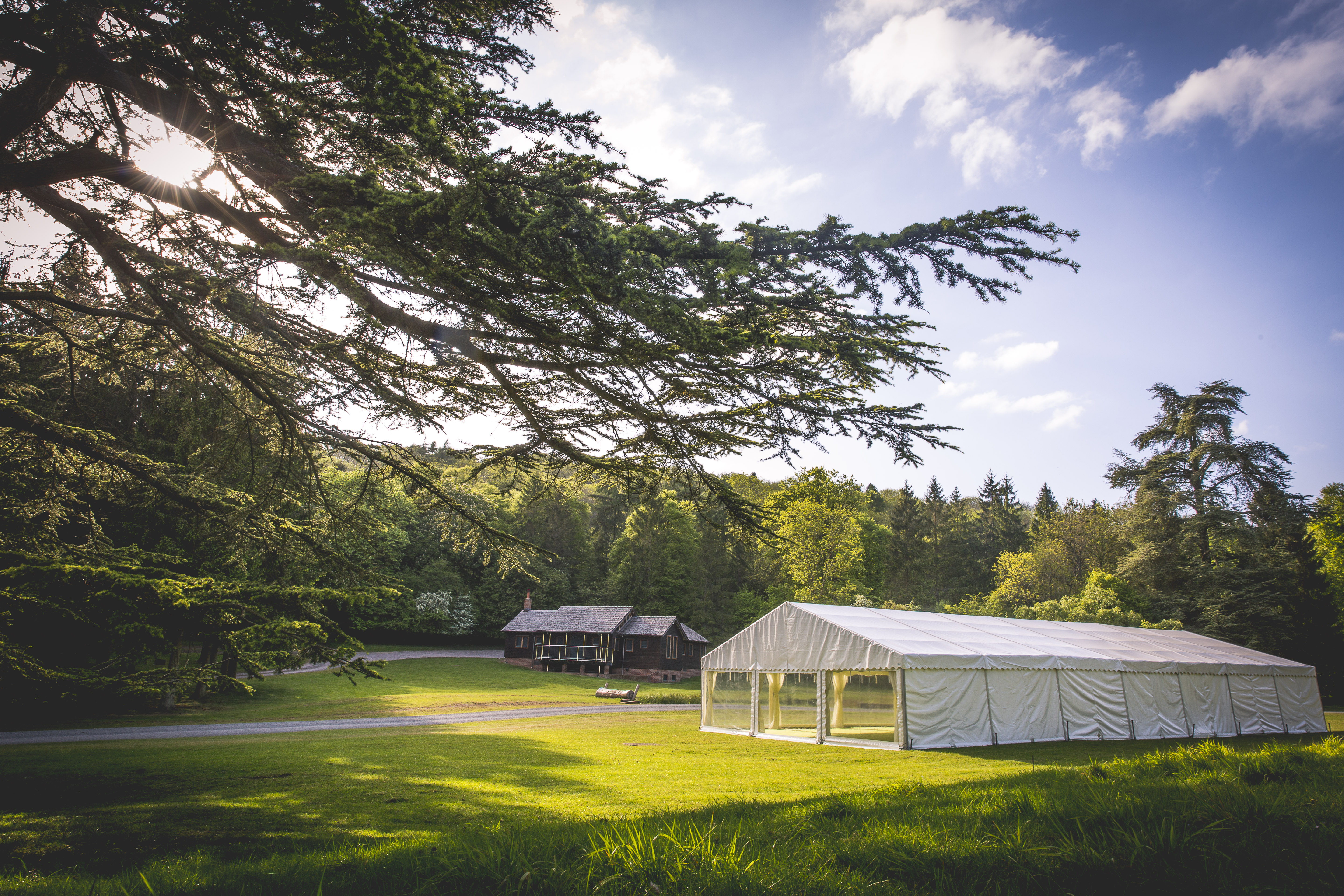 Spacious outdoor event tent at Woodland Lodge, perfect for weddings and corporate retreats.