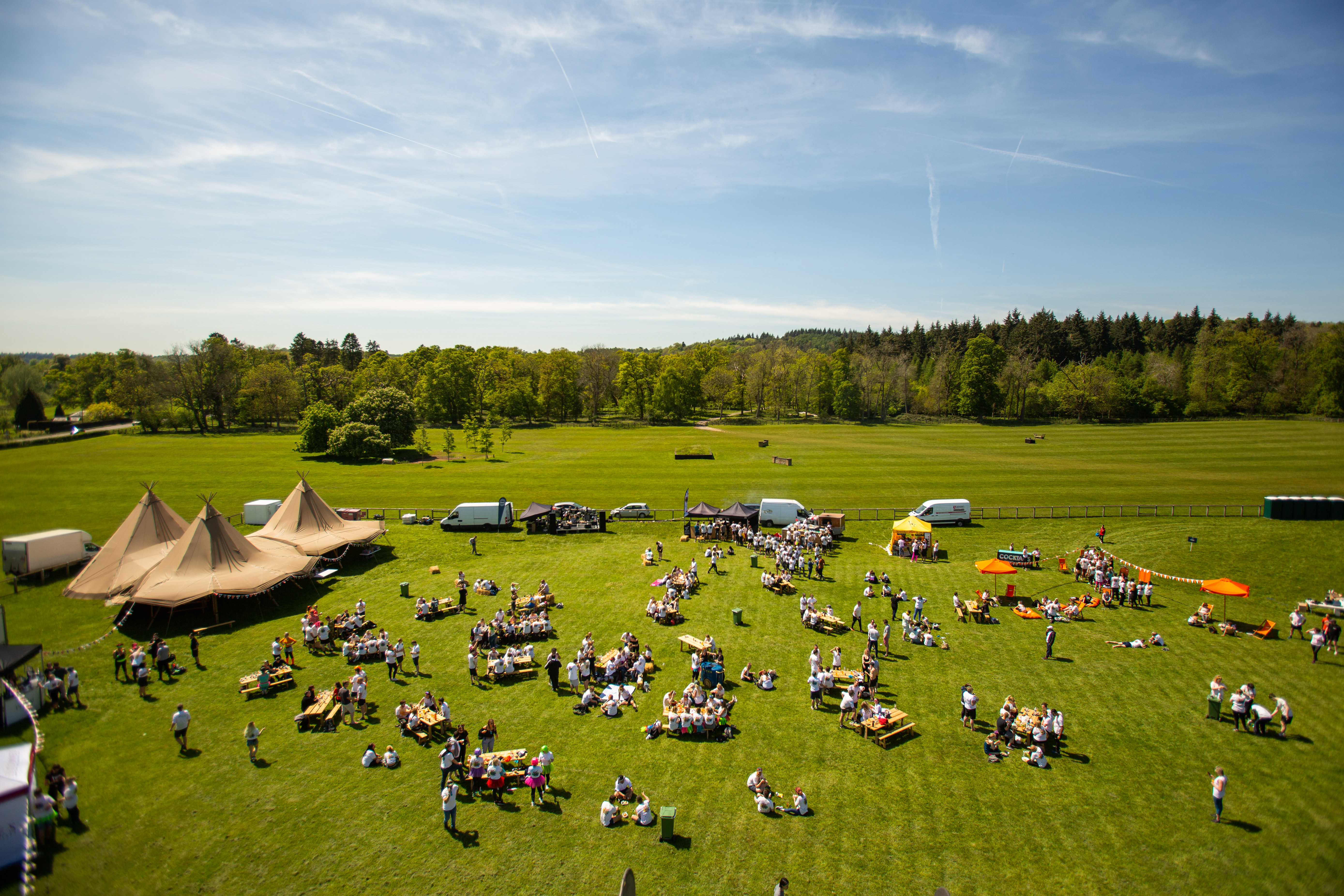 Woodland Lodge outdoor event setup with tents, ideal for networking and team-building.