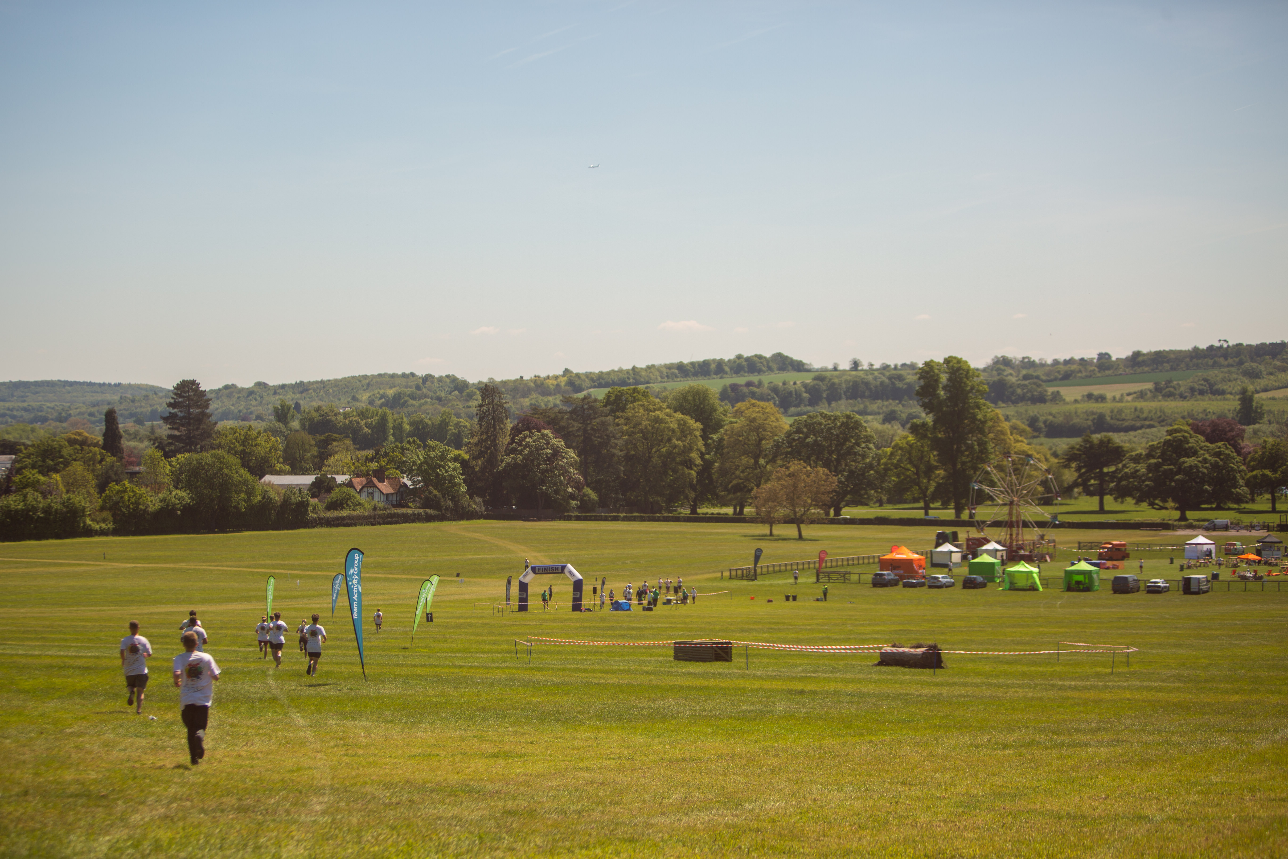 Woodland Lodge outdoor venue with green space, ideal for festivals and community events.