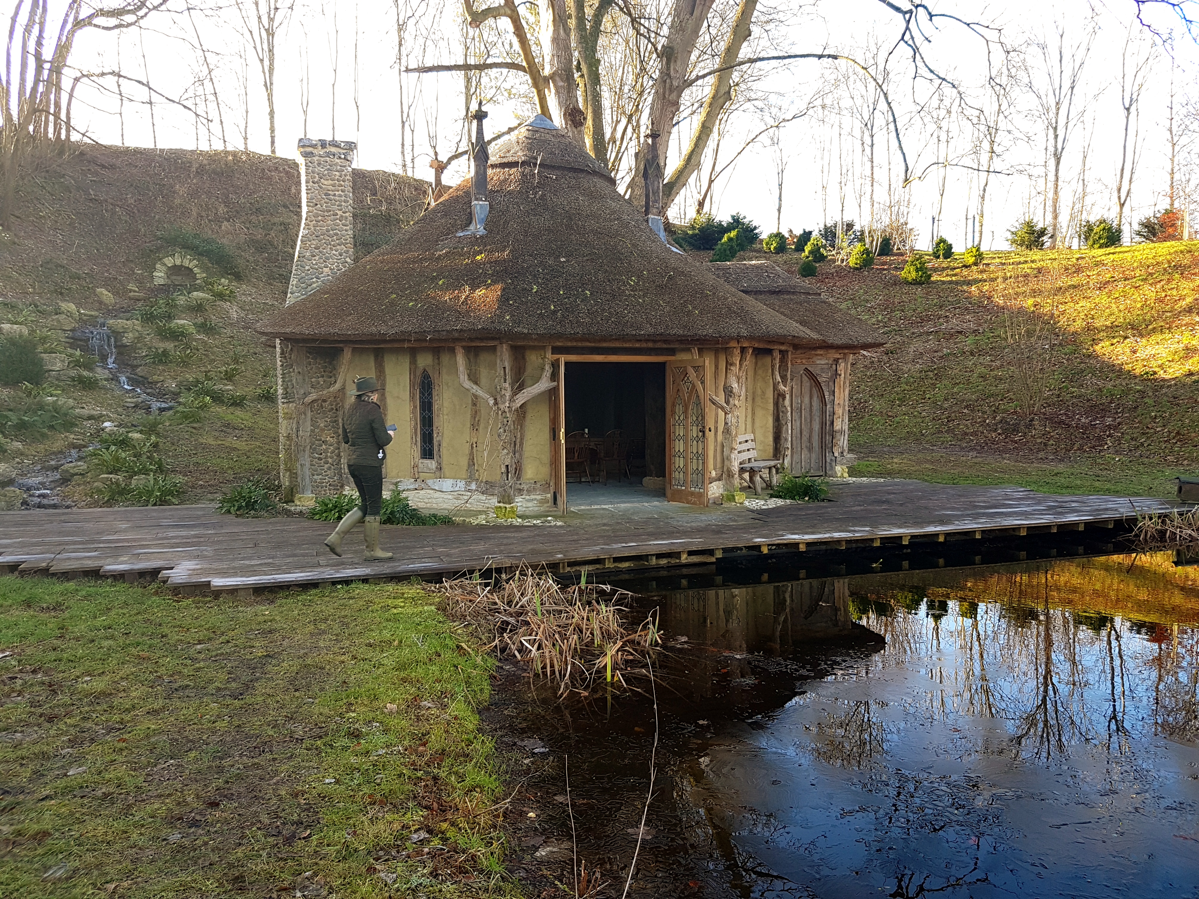Woodland Lodge with thatched roof, ideal for retreats and team-building events.