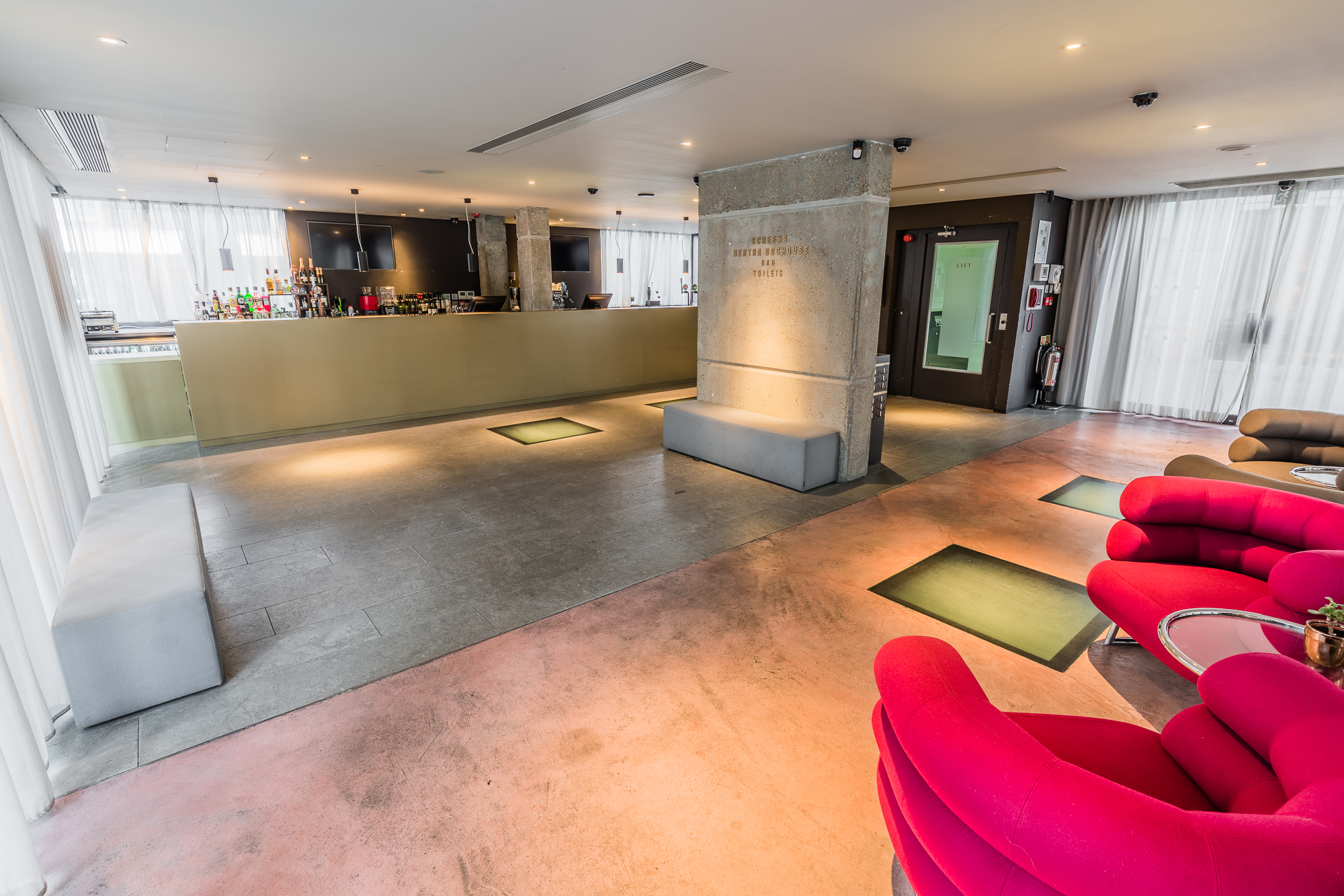 Modern event space with sleek bar and natural light at Curzon Bloomsbury.