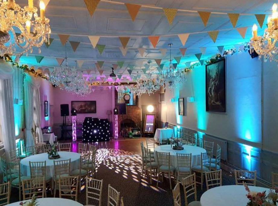 Elegant event space at The Wisley, featuring chandeliers for weddings and corporate gatherings.