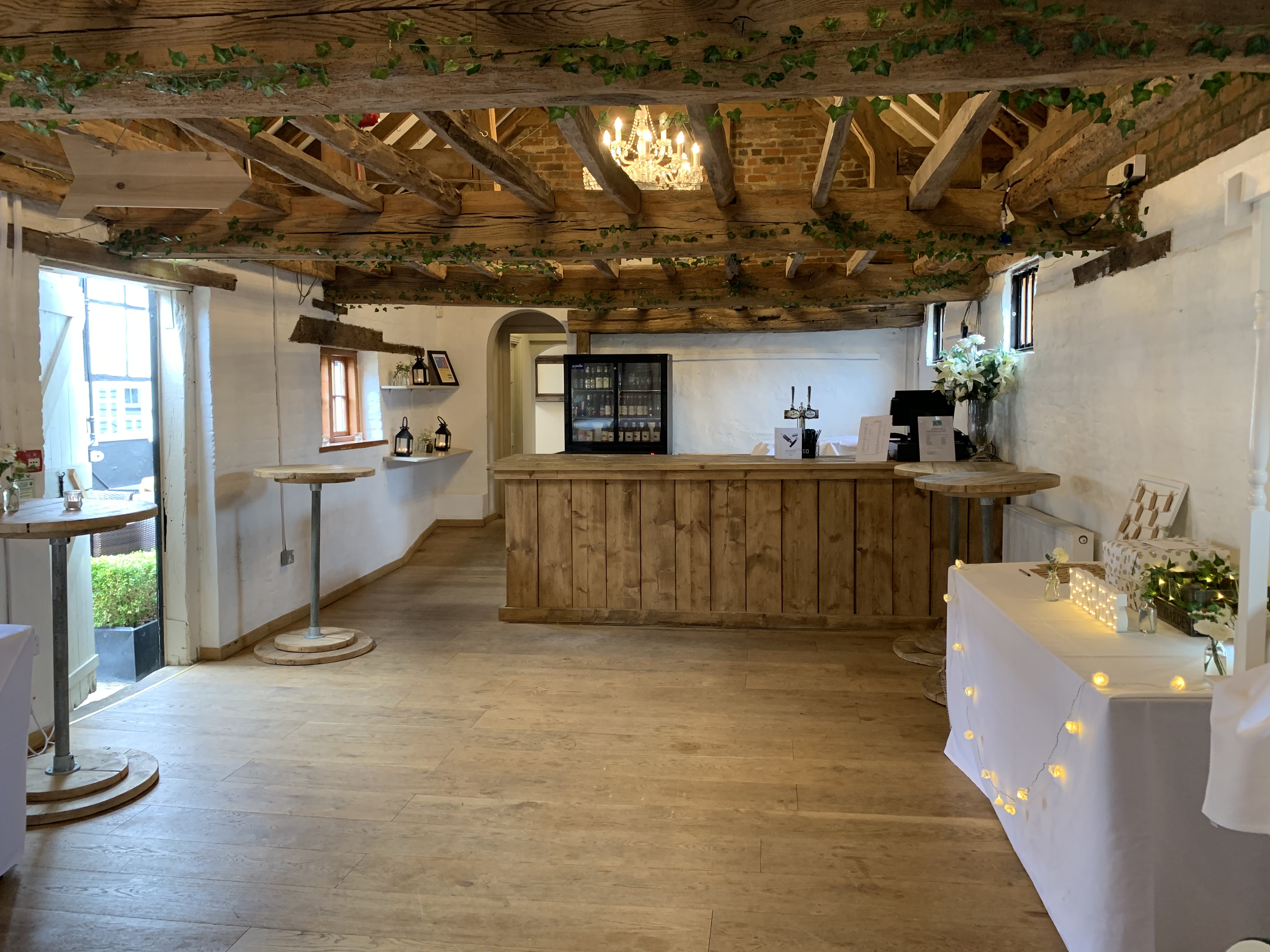 Surrey Barns event space with rustic beams, ideal for intimate gatherings and celebrations.