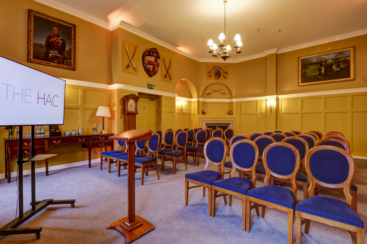 Elegant Ante Room at HAC with plush blue chairs, perfect for meetings and events.