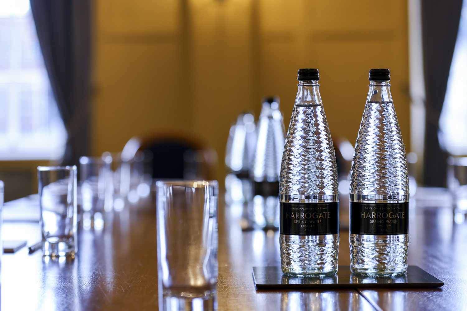 Polished conference table in HAC Ante Room, ideal for meetings and collaborations.