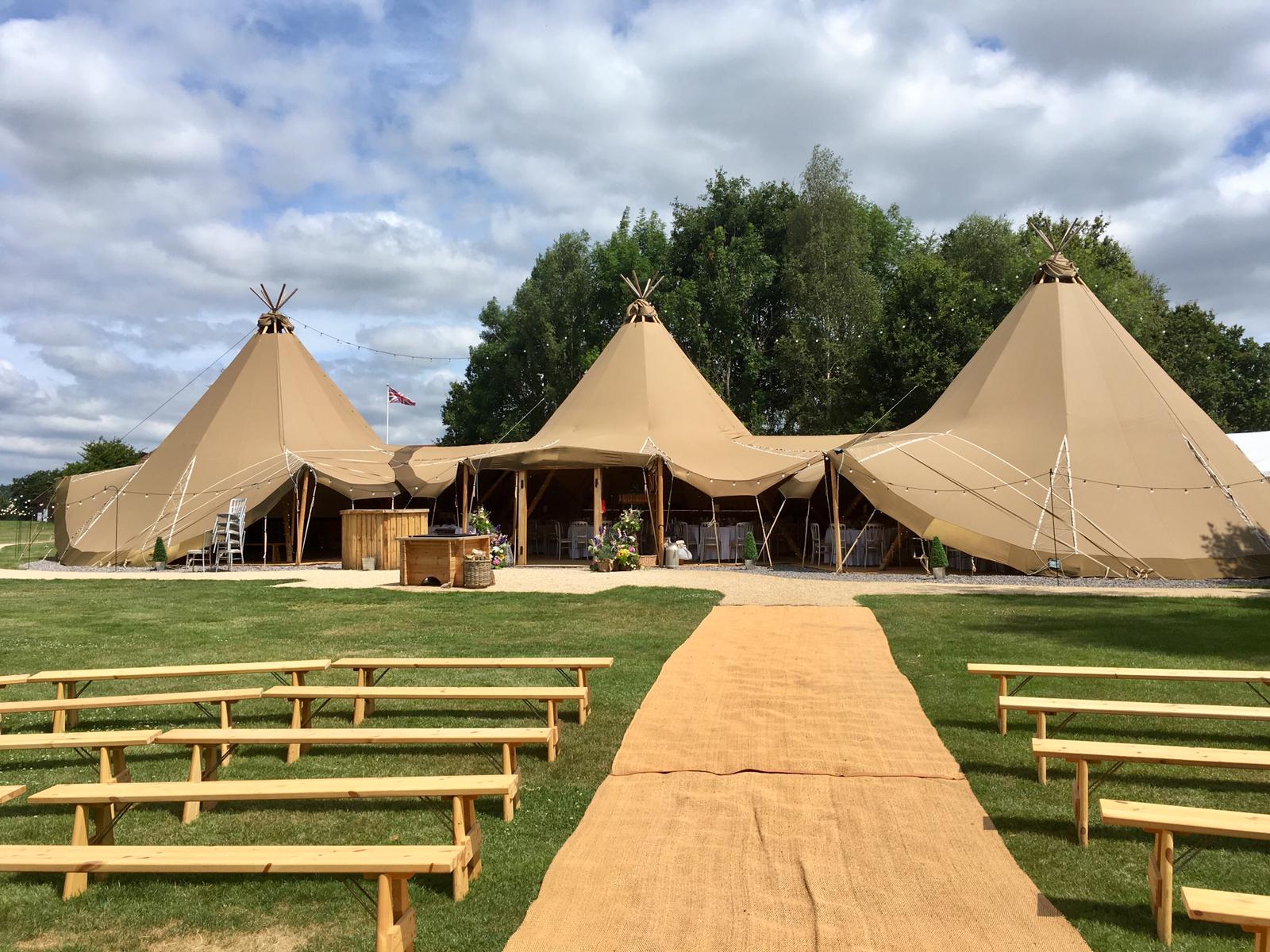 Woodlands Tipi at Blacknest Golf Club, rustic outdoor event space for weddings and retreats.