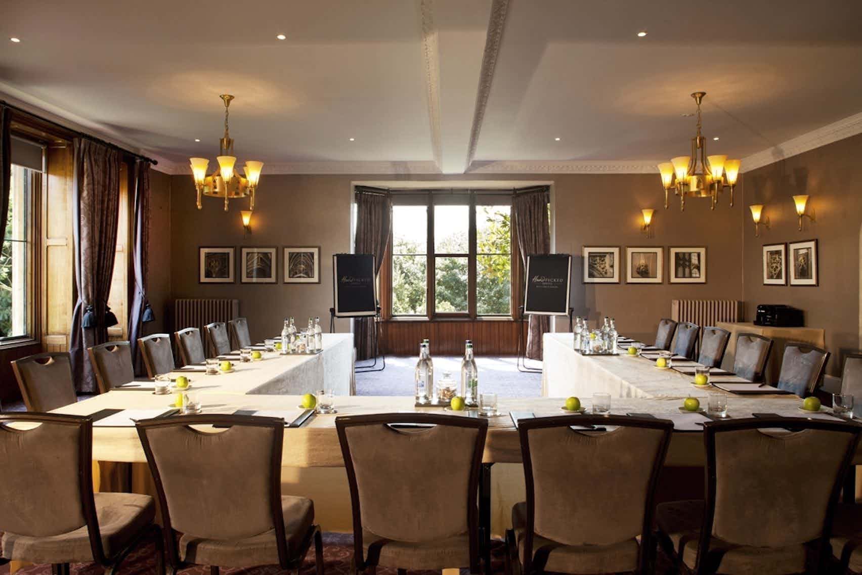 Fielden Suite at Nutfield Priory: elegant meeting room with U-shaped table for corporate events.