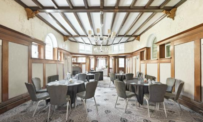 Ballroom at Richmond Hill Hotel with elegant wood paneling, ideal for meetings and events.