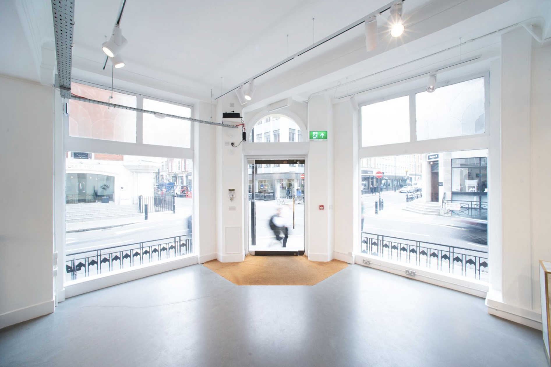 Bright event space with large windows at Whole Venue, ideal for meetings and workshops.