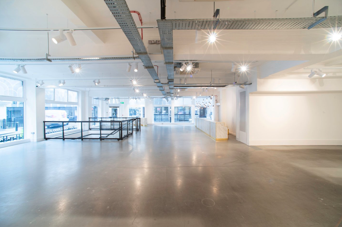 Spacious modern event venue with natural light for corporate meetings and art exhibitions.