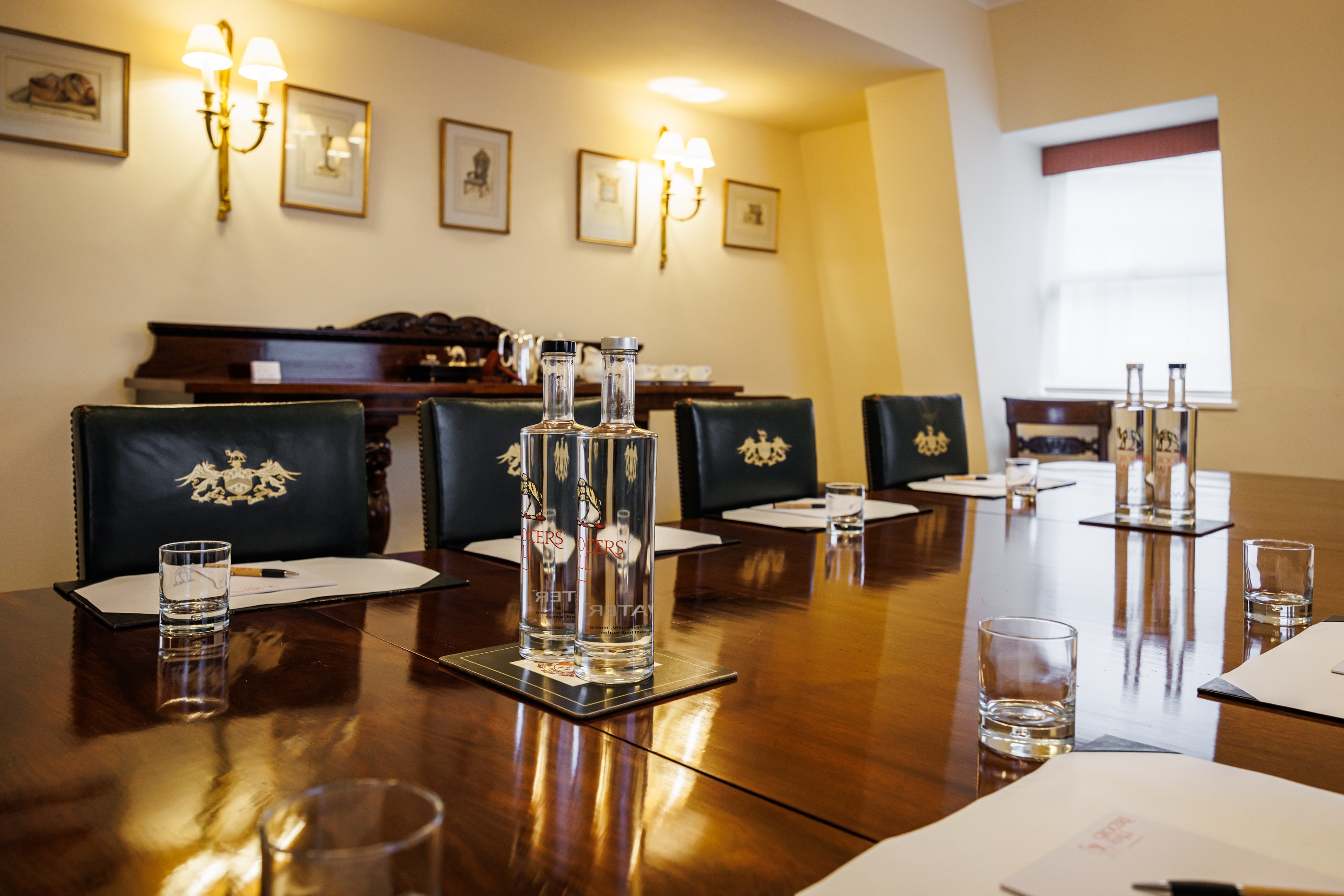 Pitt Library meeting room with polished table, ideal for professional gatherings and events.