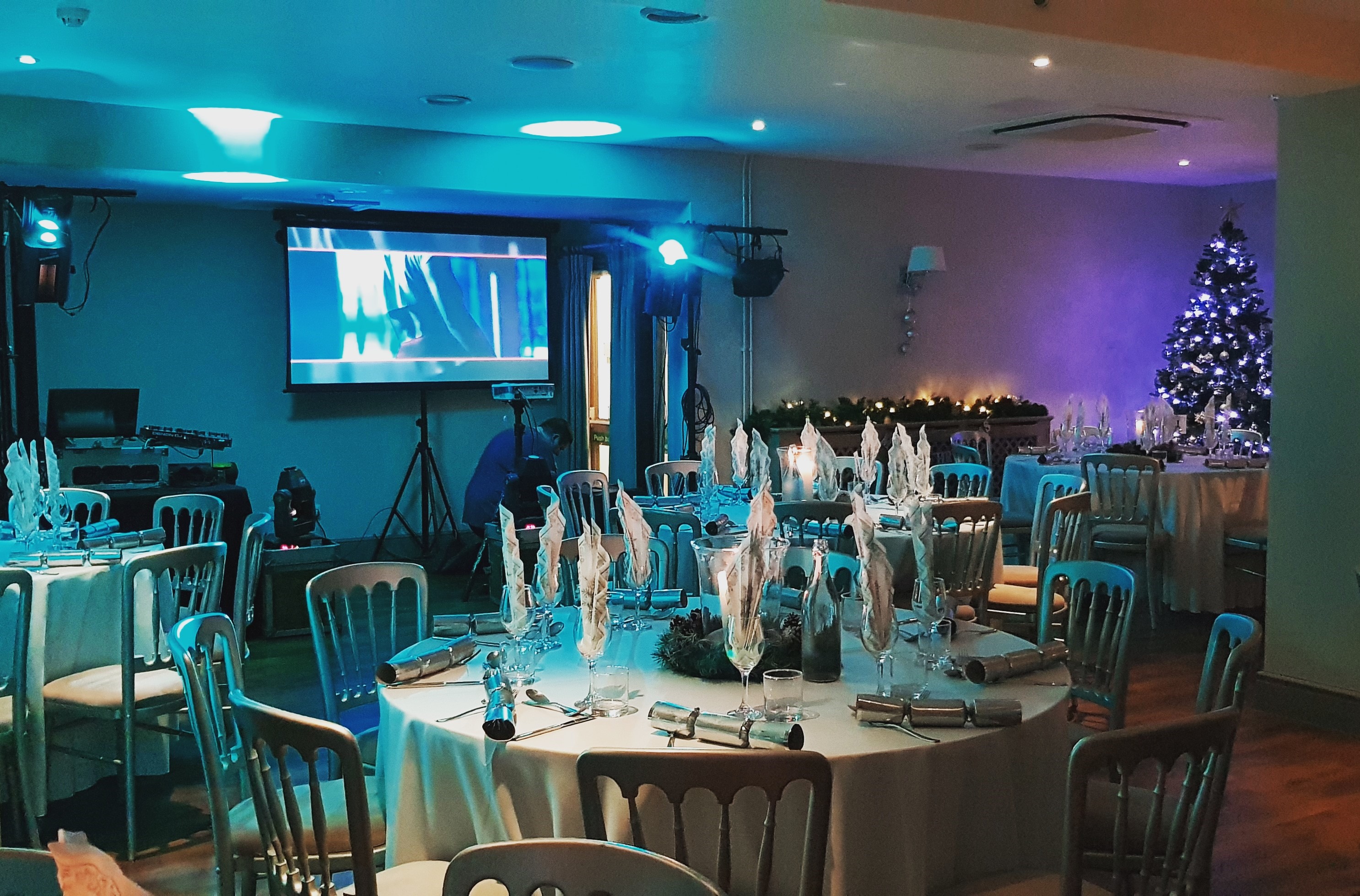 Elegant event space at Blacknest Golf Club with festive decor and warm lighting.