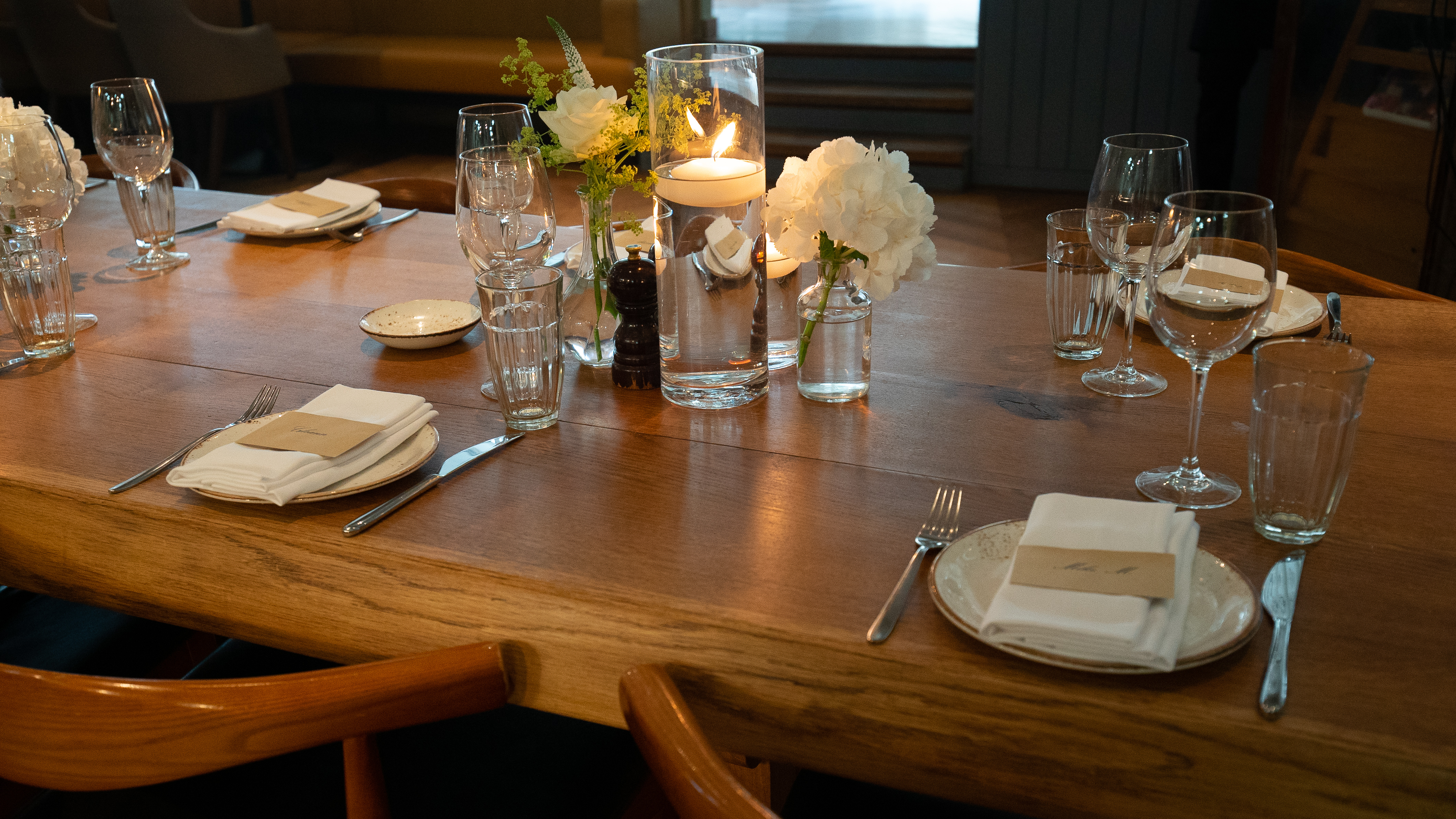 Semi-private dining room at TOZI Restaurant, elegant table setting for intimate events.