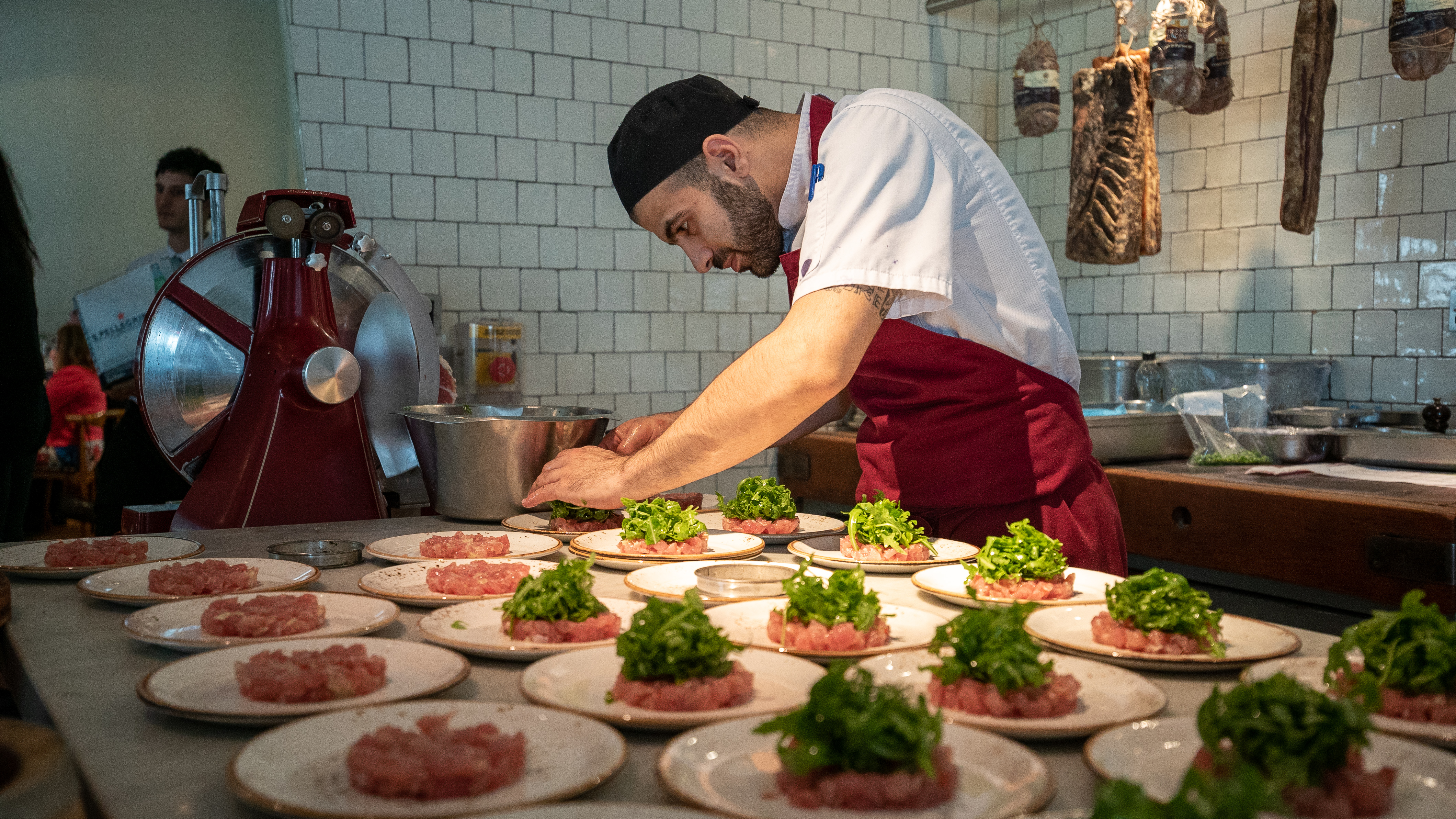Semi-private dining room at TOZI Restaurant, showcasing gourmet dish plating for upscale events.