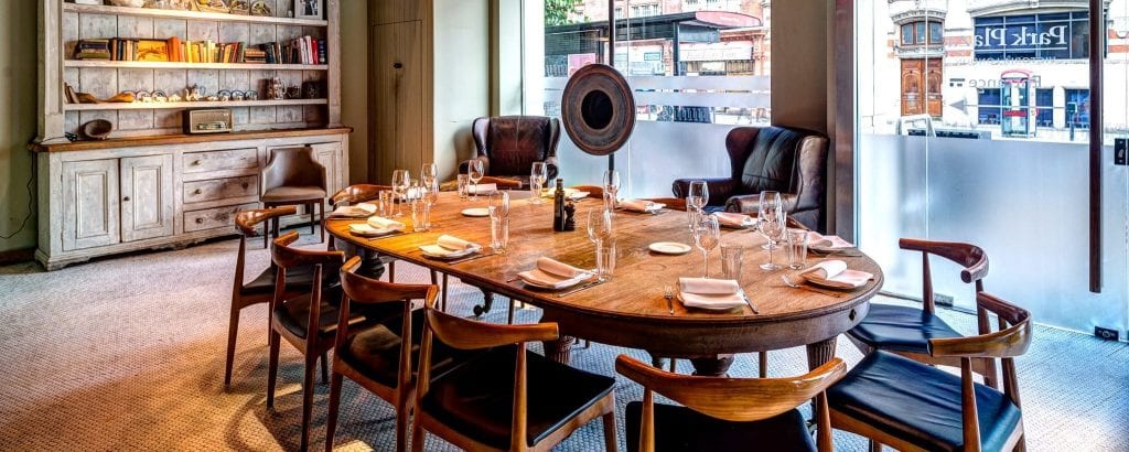 Semi-private dining room at TOZI Restaurant, ideal for intimate meetings and gatherings.