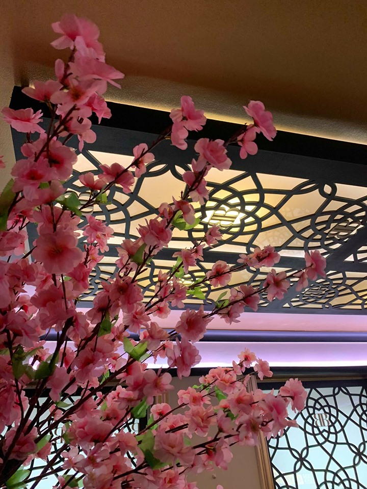 Elegant event space in Bar Beyond with cherry blossoms, ideal for upscale gatherings.