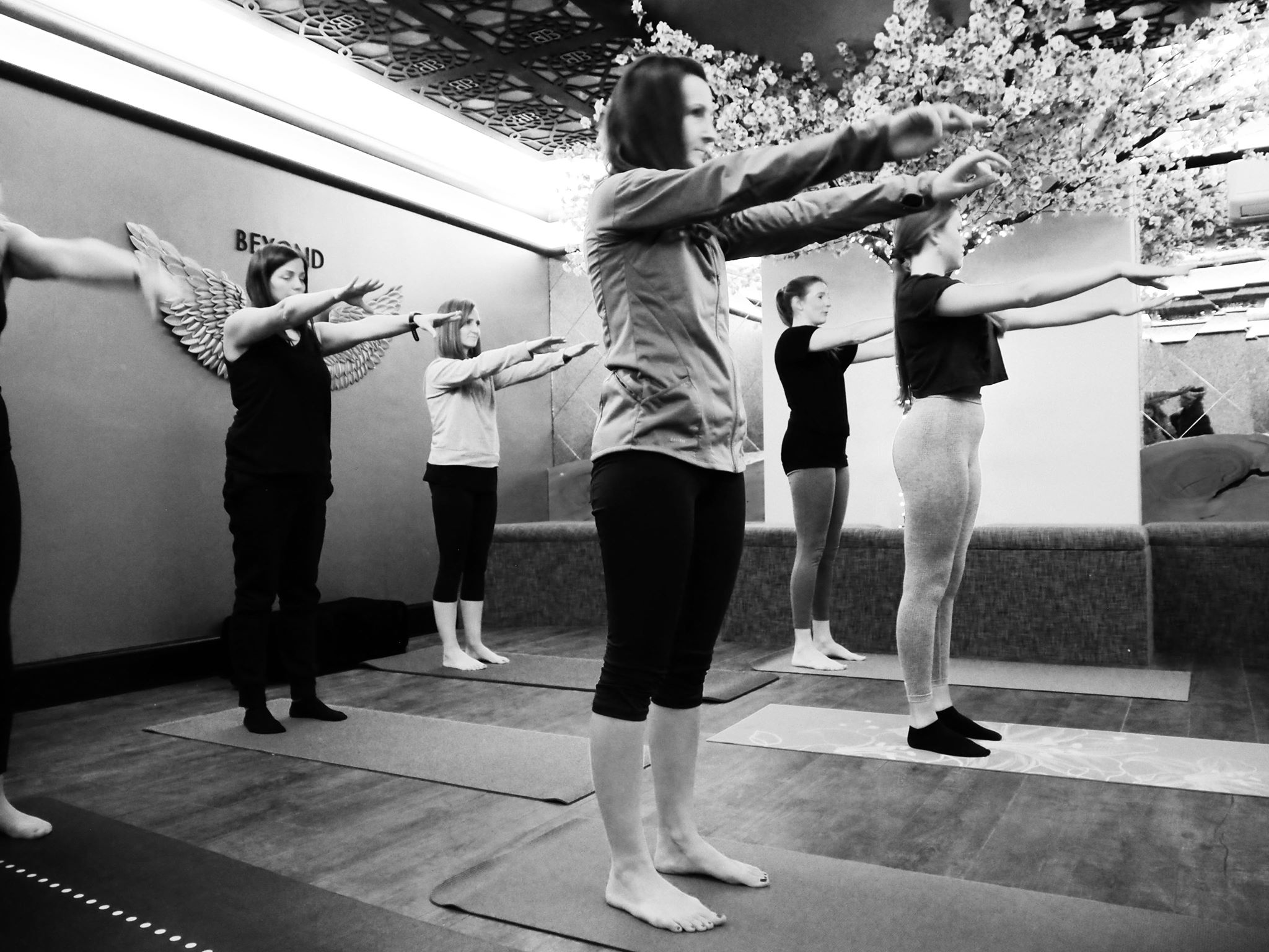 Wellness yoga session in modern event space, promoting mindfulness and engagement.