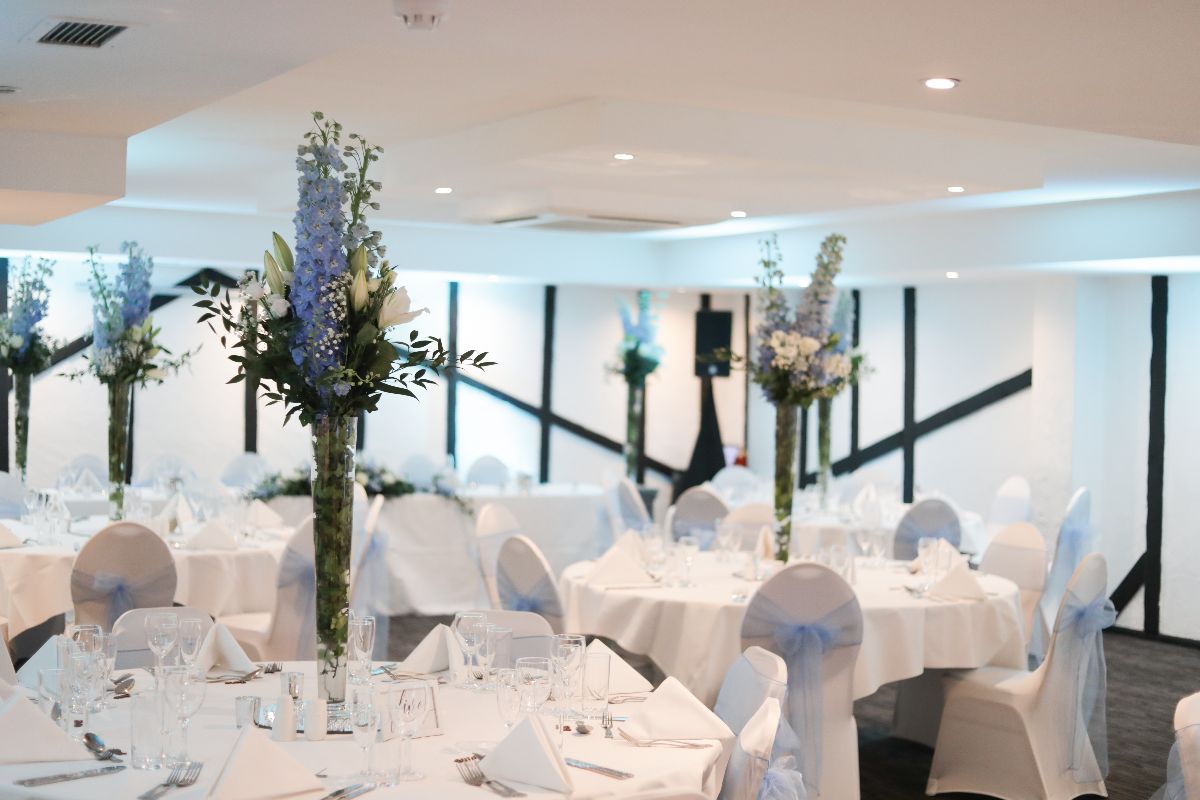 Elegant Riverhead Suite with floral centerpieces for weddings and corporate events.