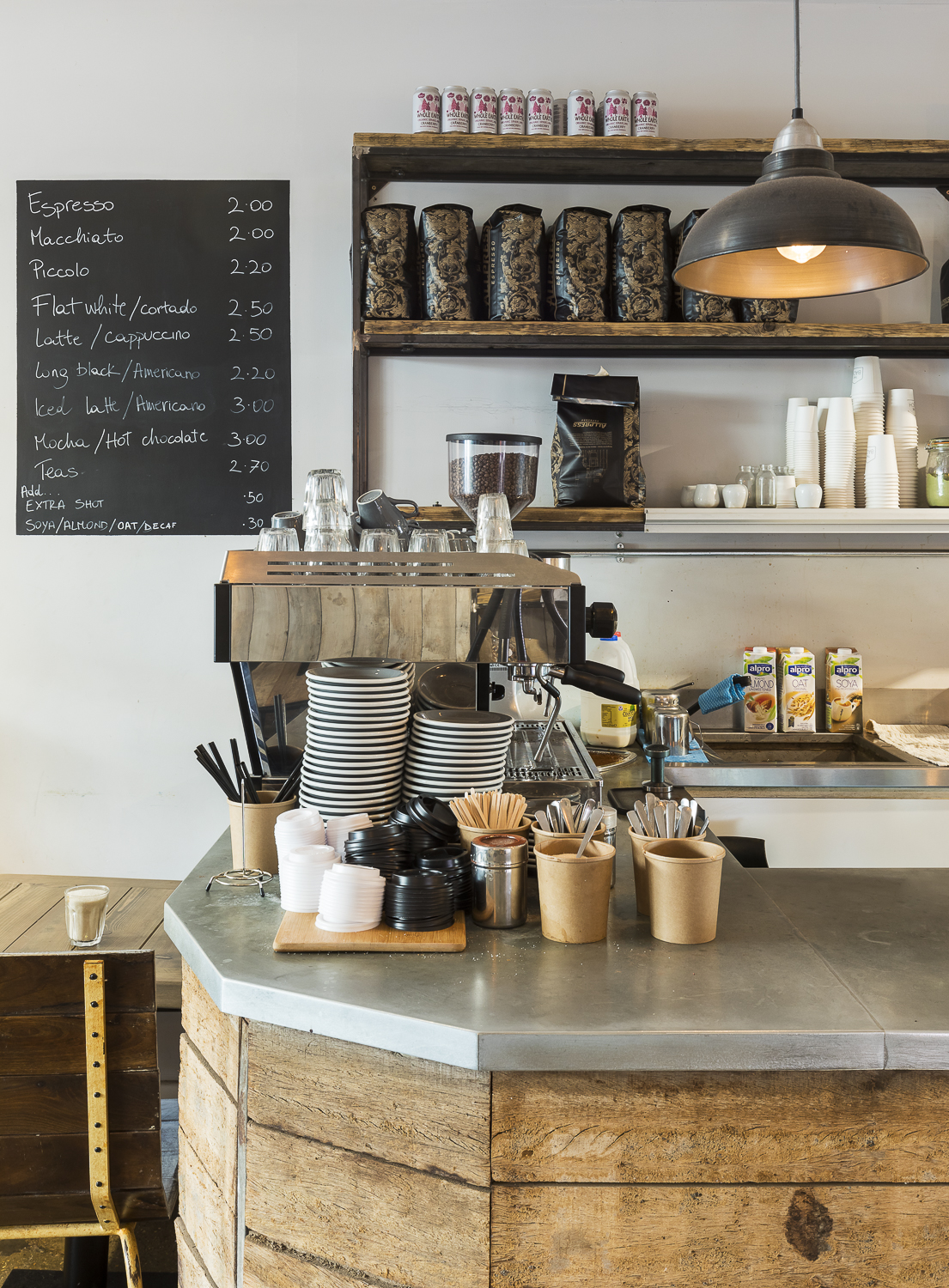 "Coffee station at Cafe Broadway Market for events, featuring espresso machine and cups."