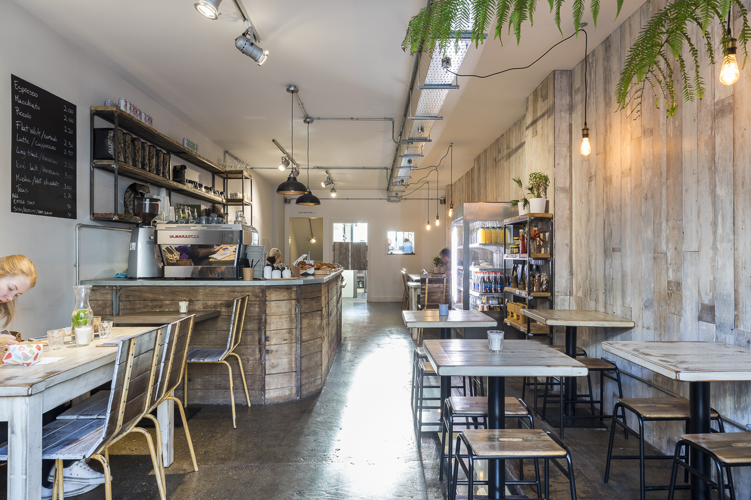 Cozy Cafe Broadway Market with warm wood accents, ideal for meetings and events.