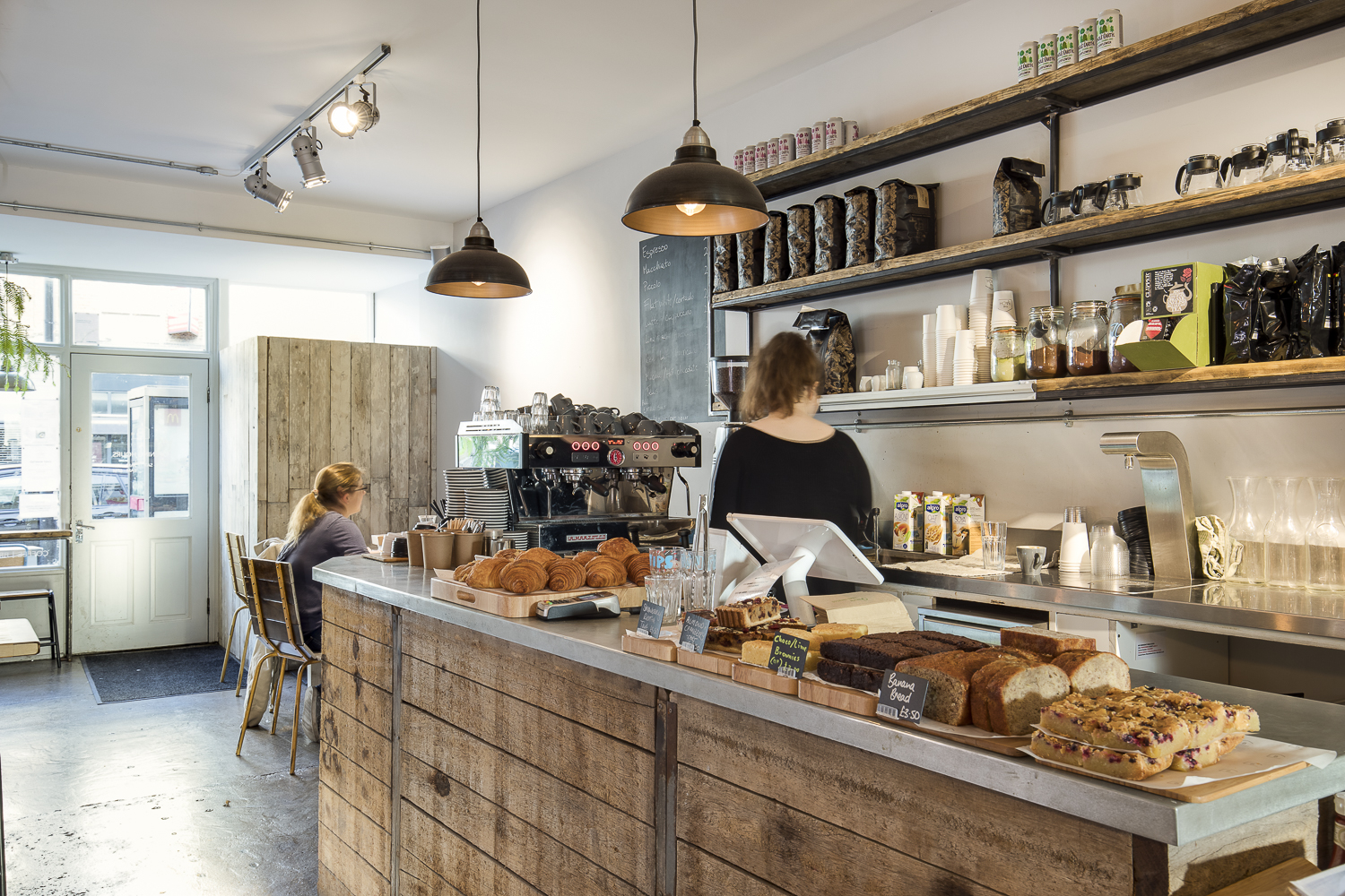 Cozy Cafe Broadway Market with rustic decor, ideal for networking events and meetings.