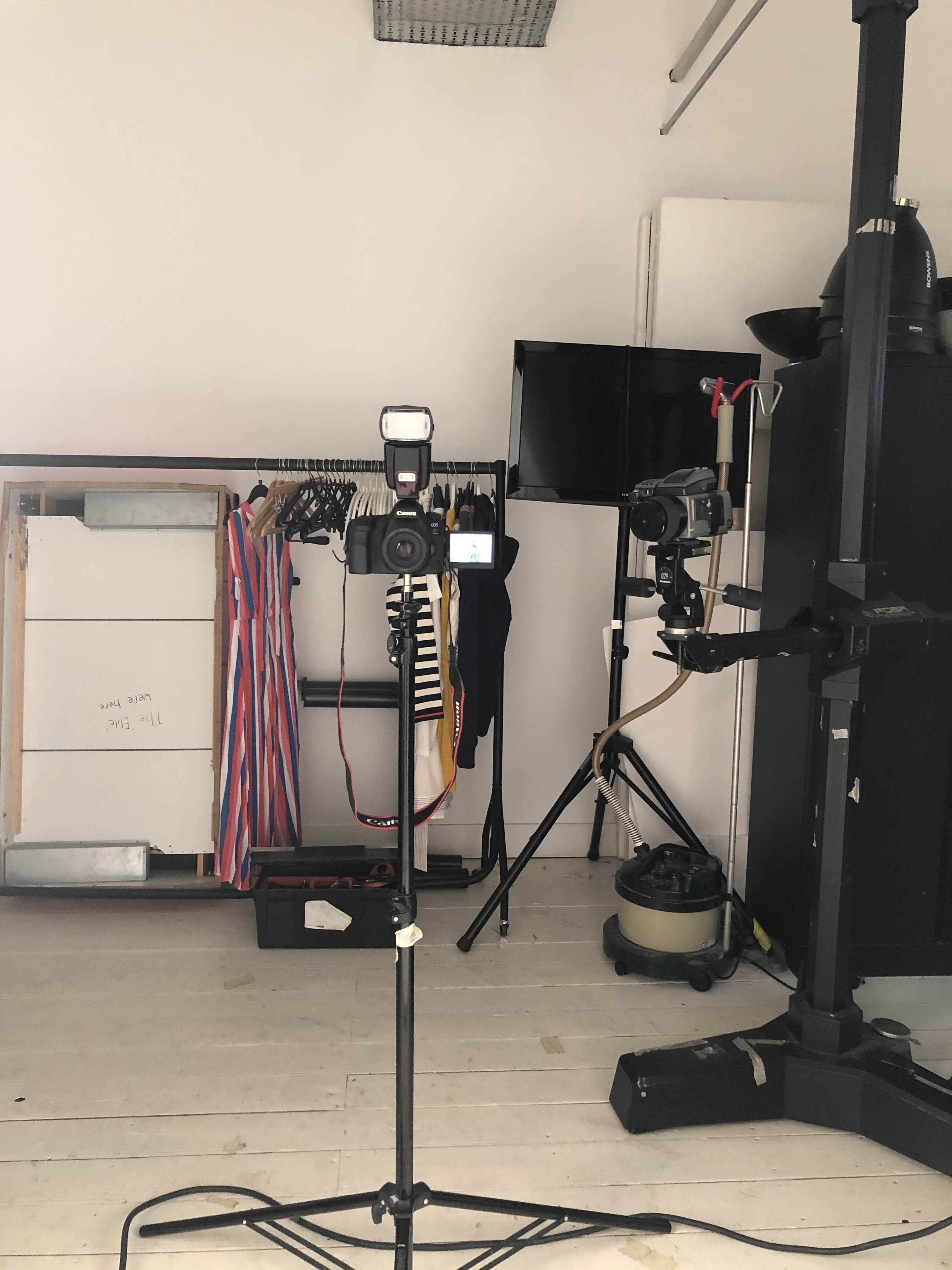 Photography studio setup with cameras and lighting for event production.