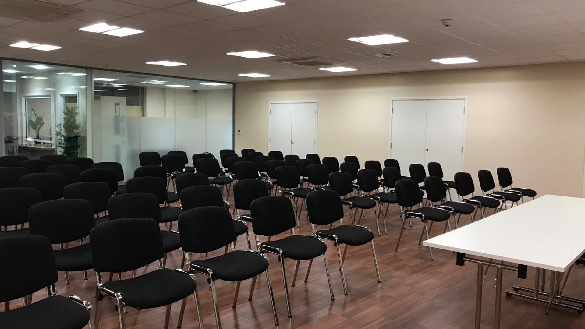 St Katherine Conference Hall with black chairs, ideal for professional meetings and workshops.